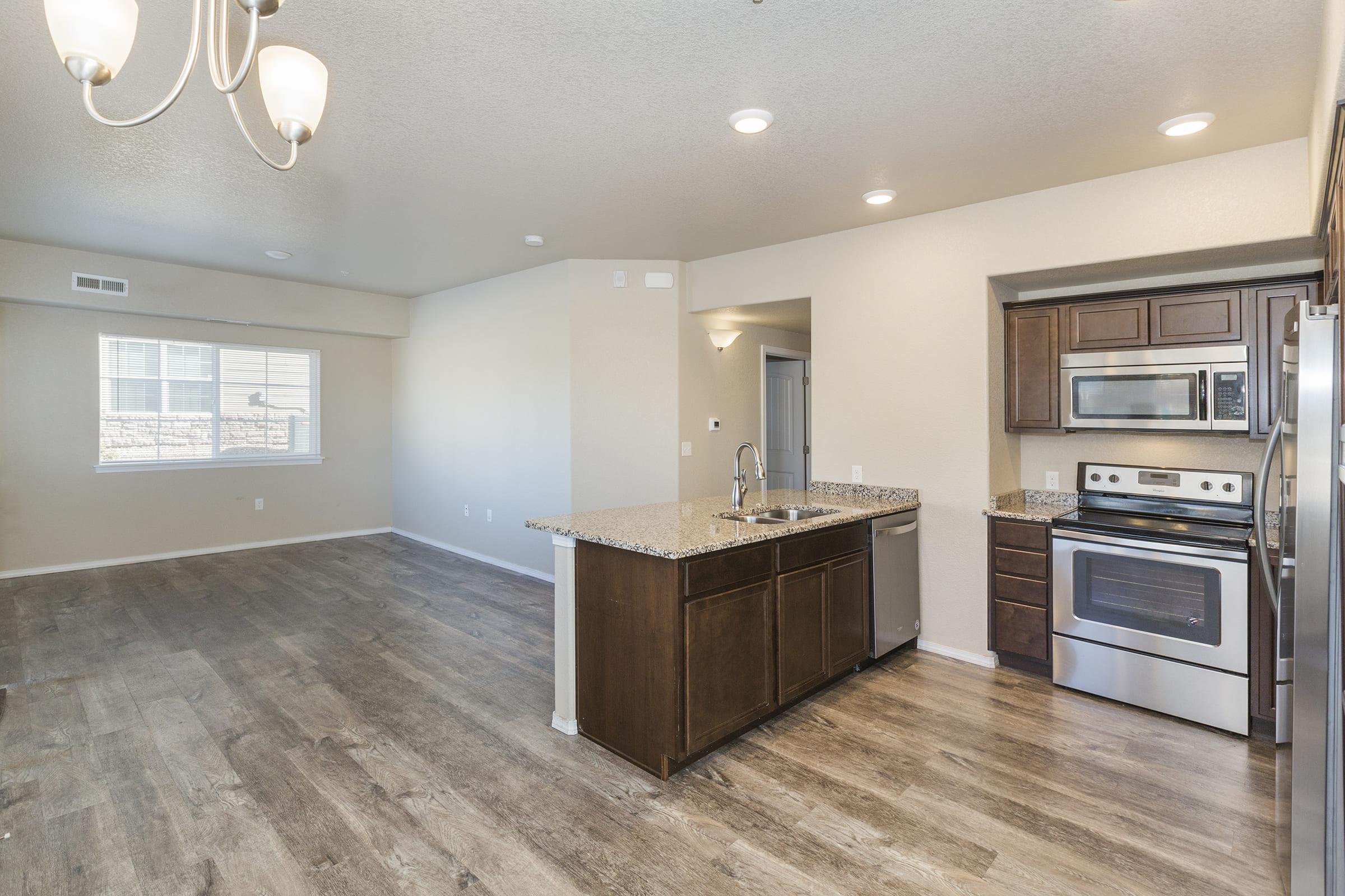 a large kitchen with stainless steel appliances