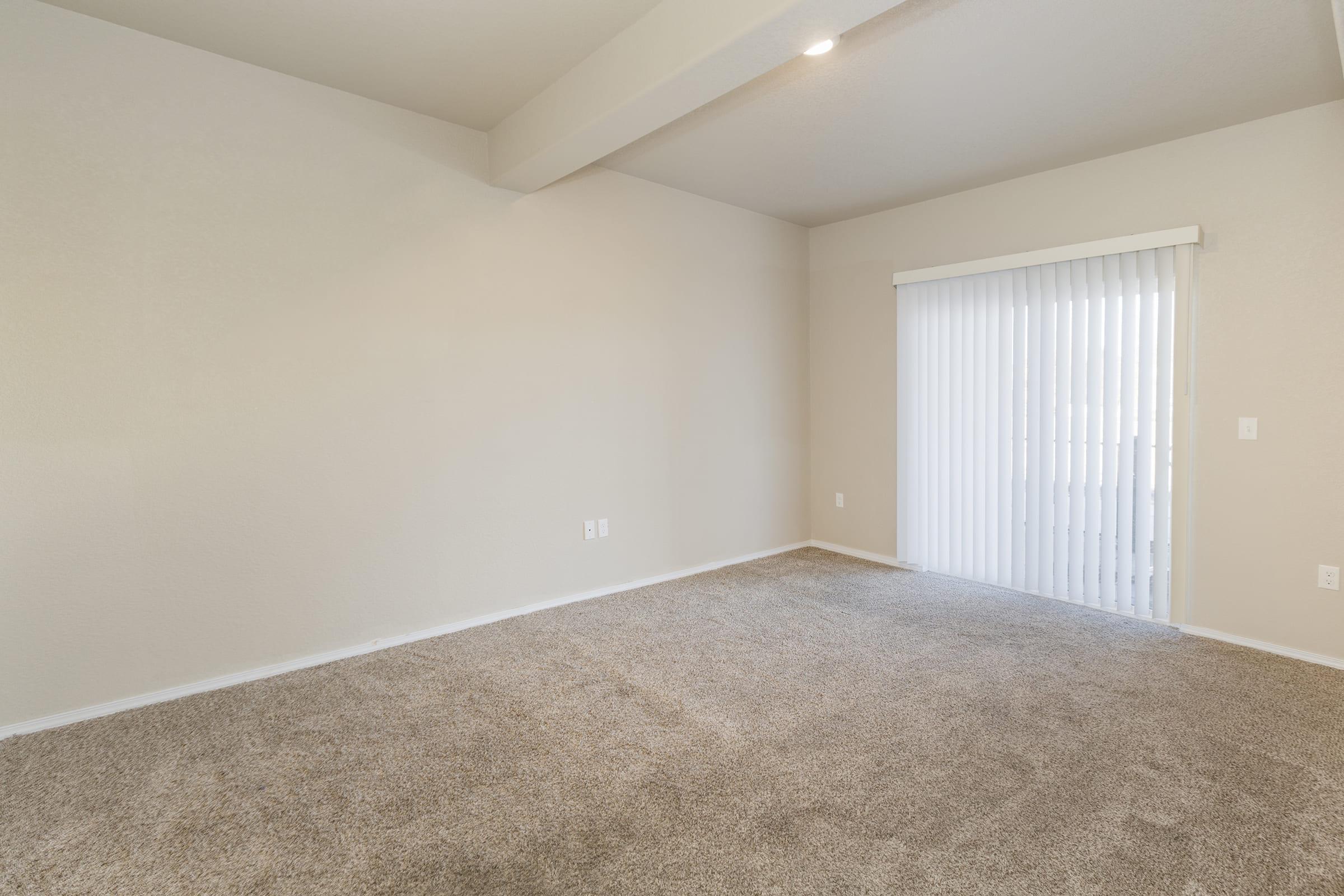 a bedroom with a large window