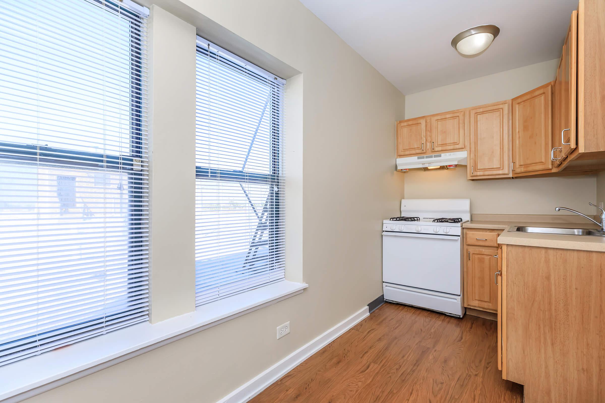 a kitchen with a sink and a window