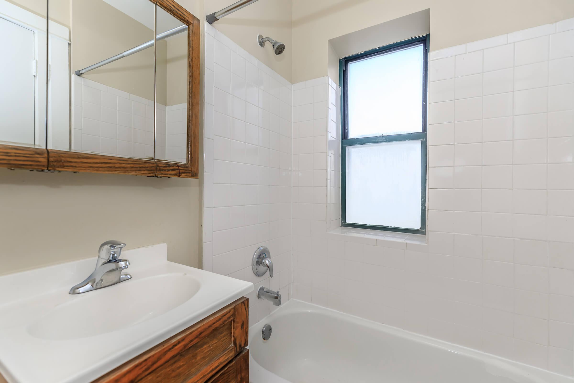 a room with a sink and a bath tub