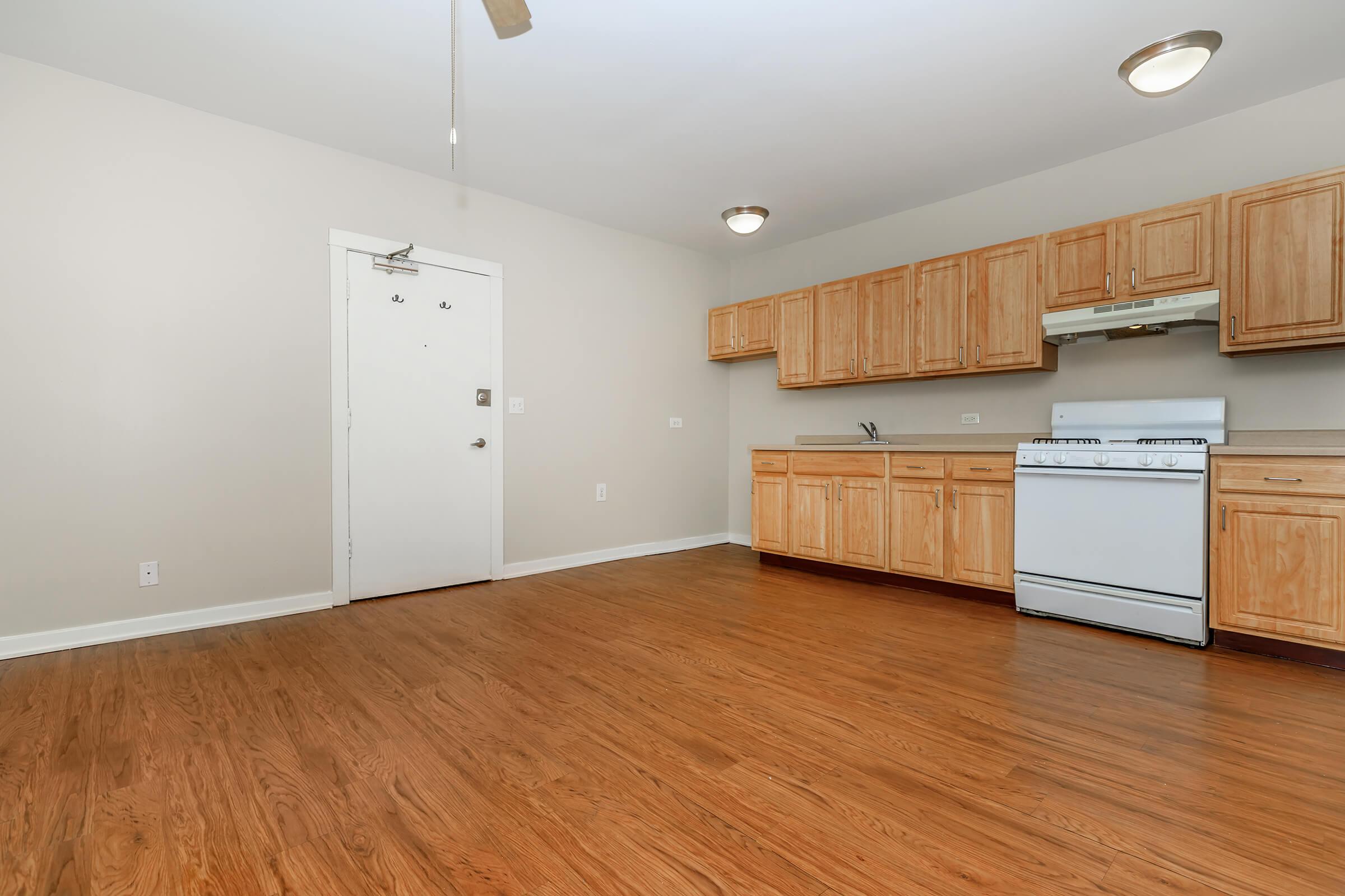 a kitchen with a wood floor