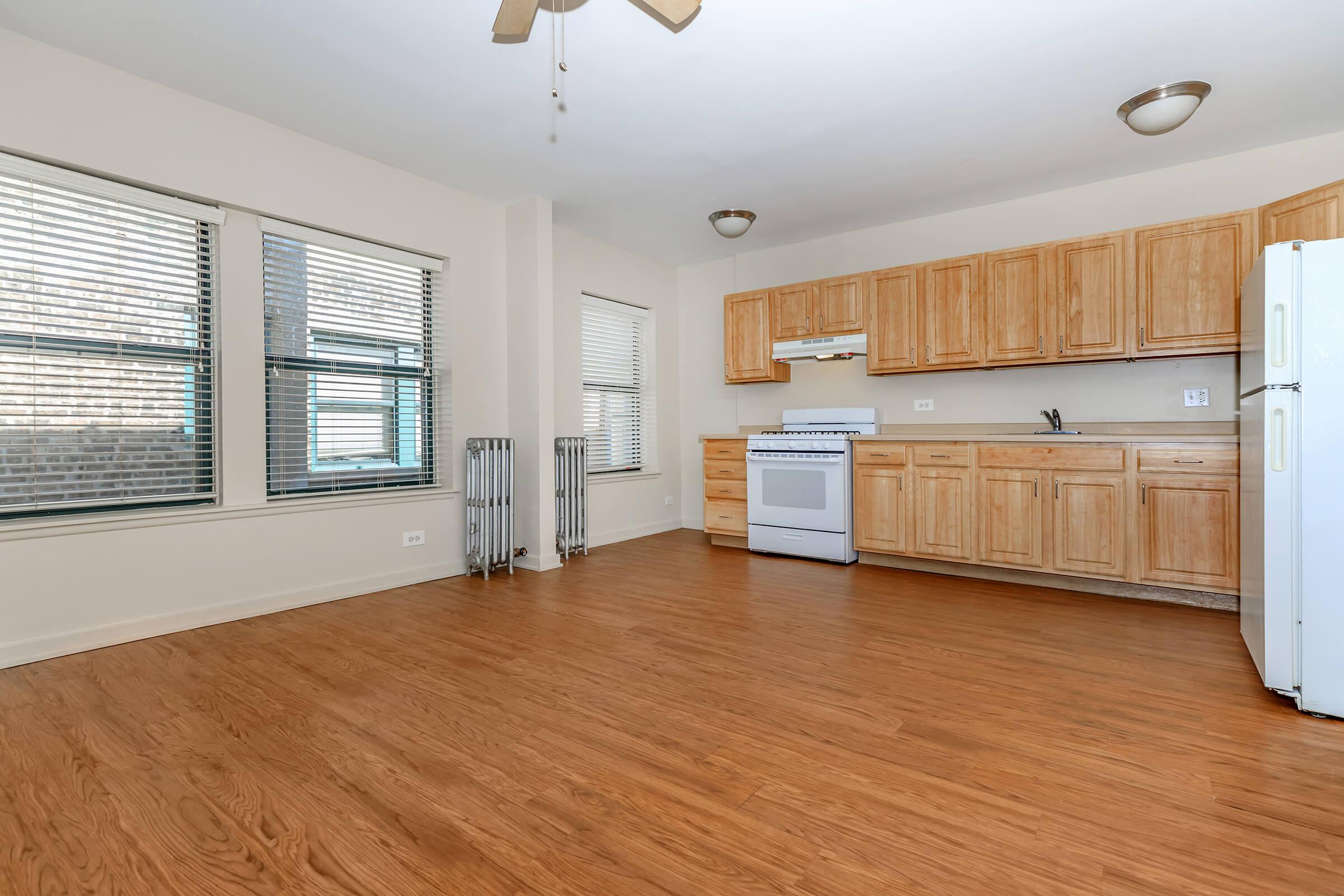 a kitchen with a wood floor