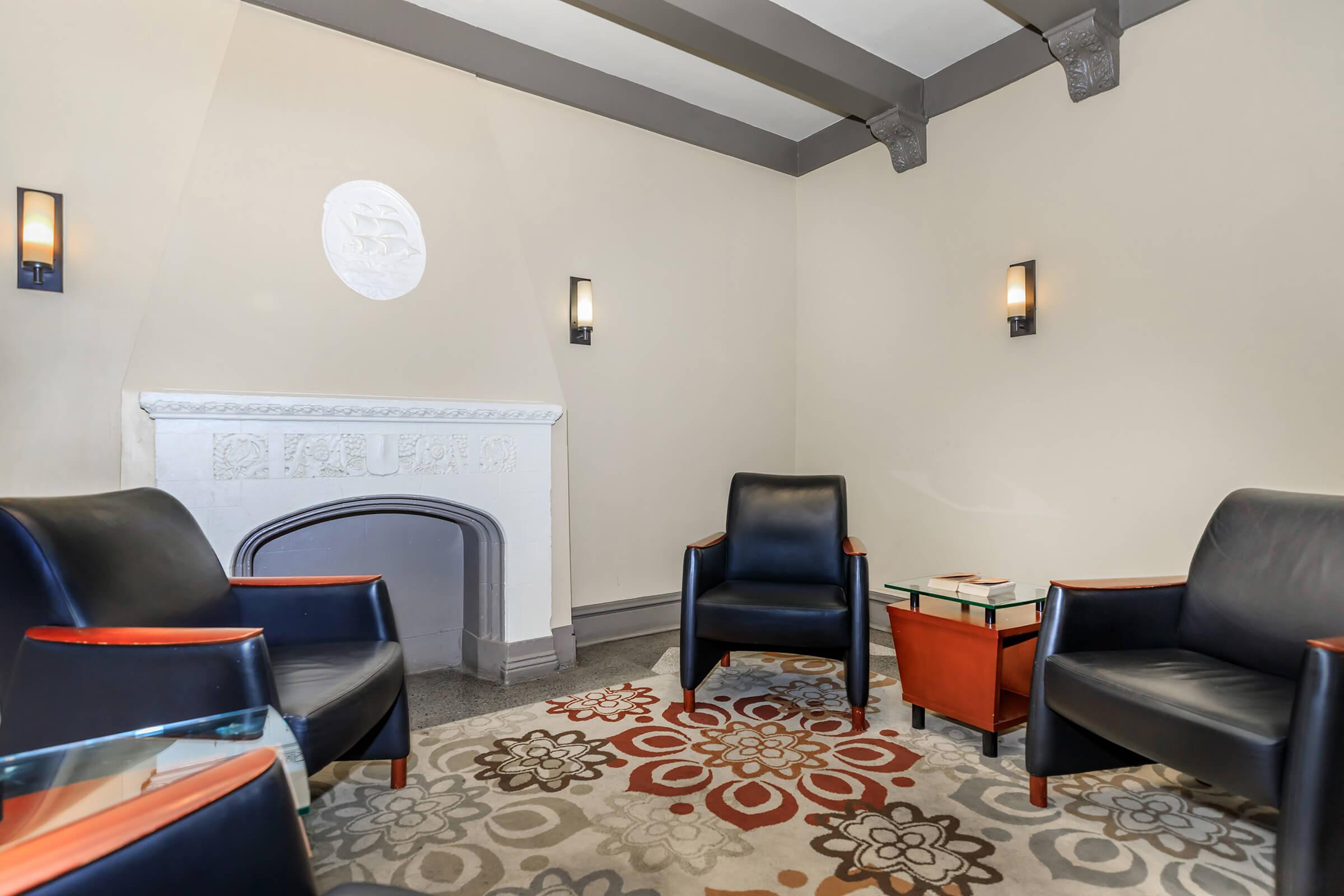 a living room filled with furniture and a table