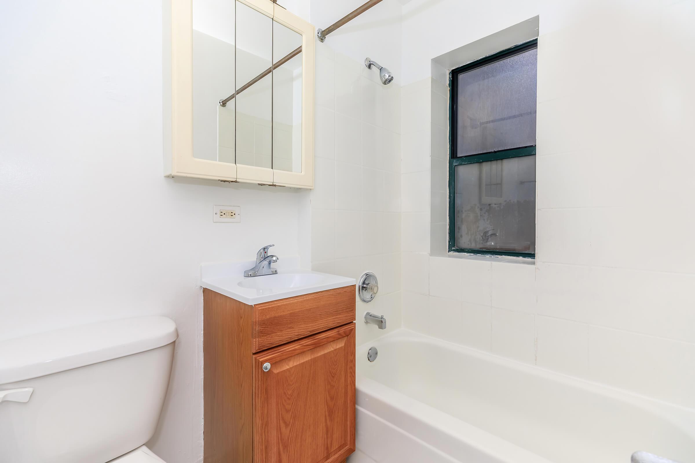 a shower that has a sink and a mirror