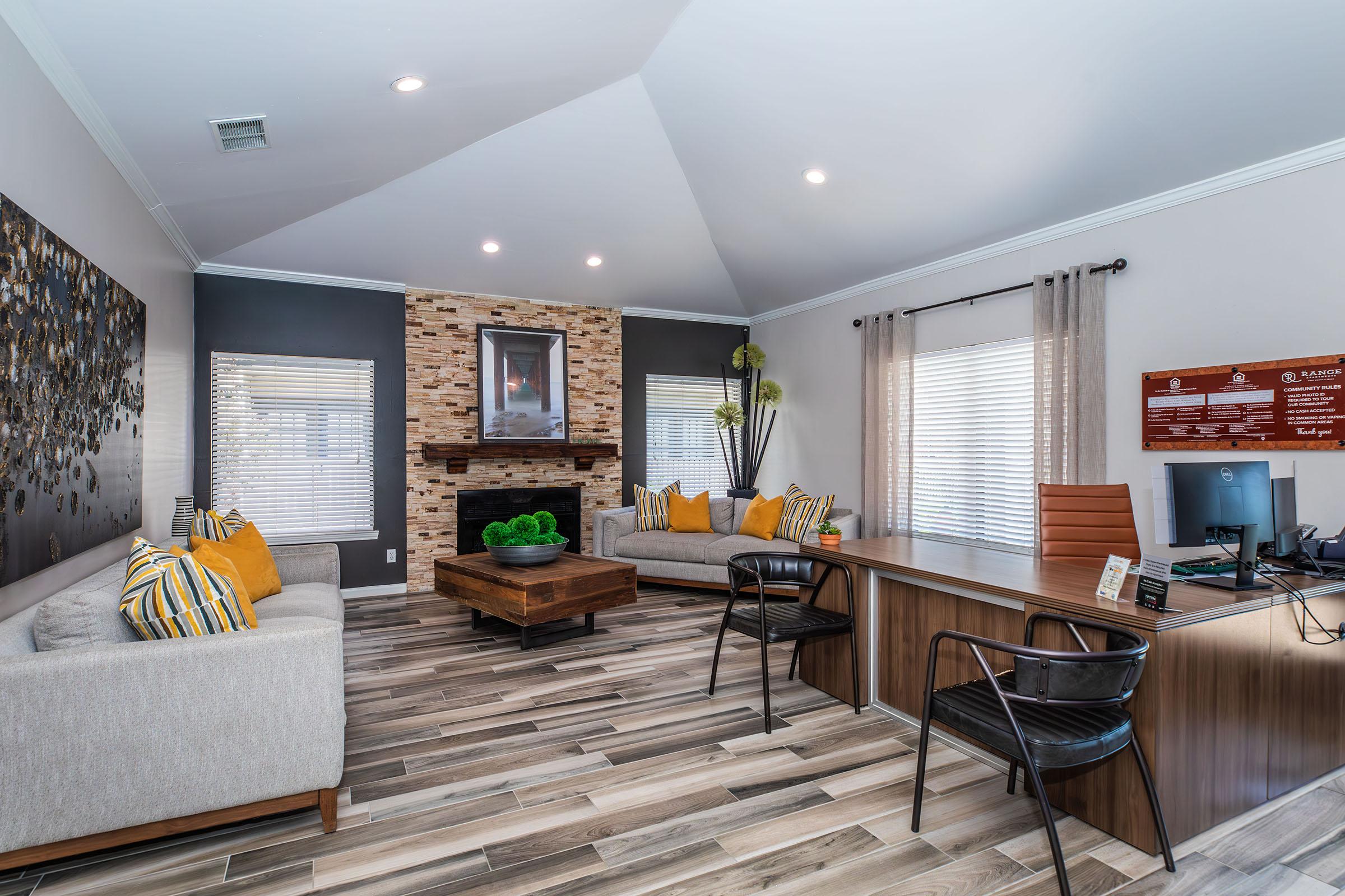 a living room filled with furniture and a flat screen tv