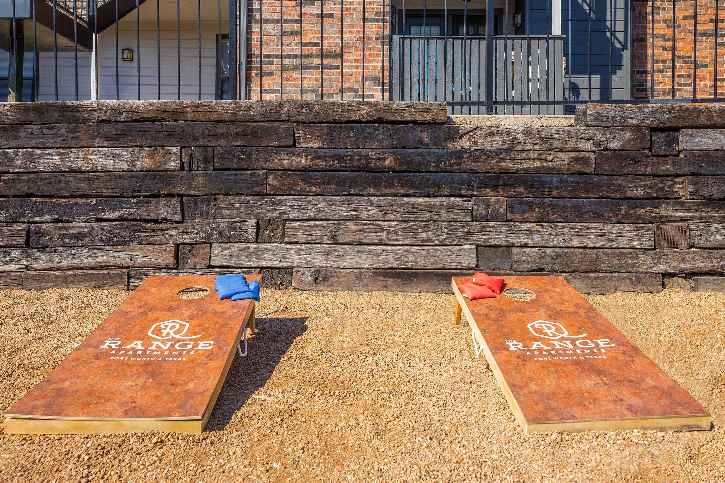 a wooden bench in front of a brick building