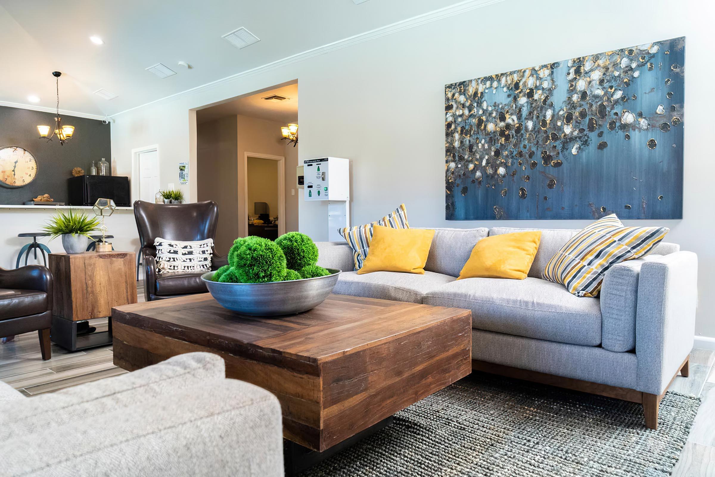 a living room filled with furniture and a large window