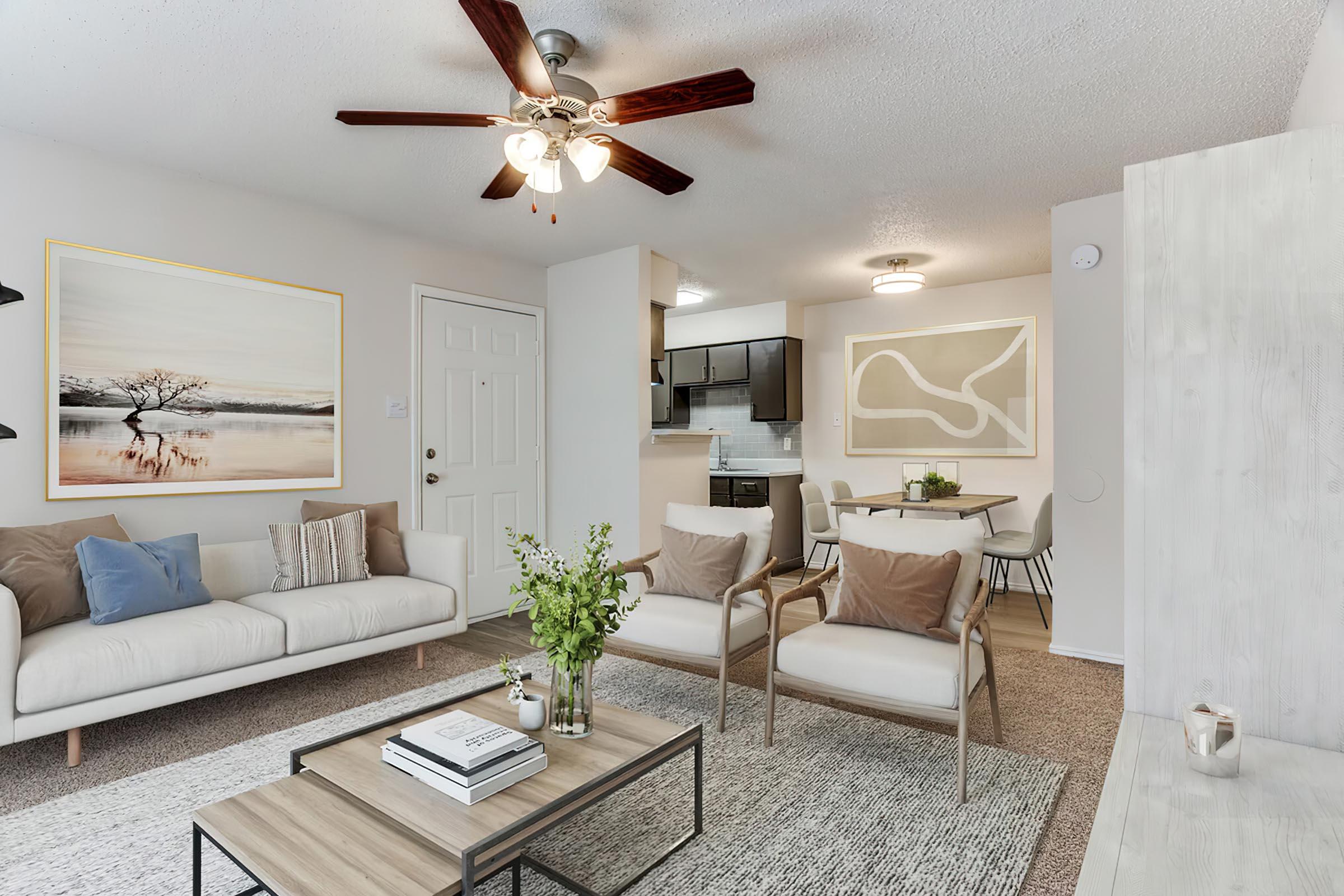 a living room filled with furniture and a mirror