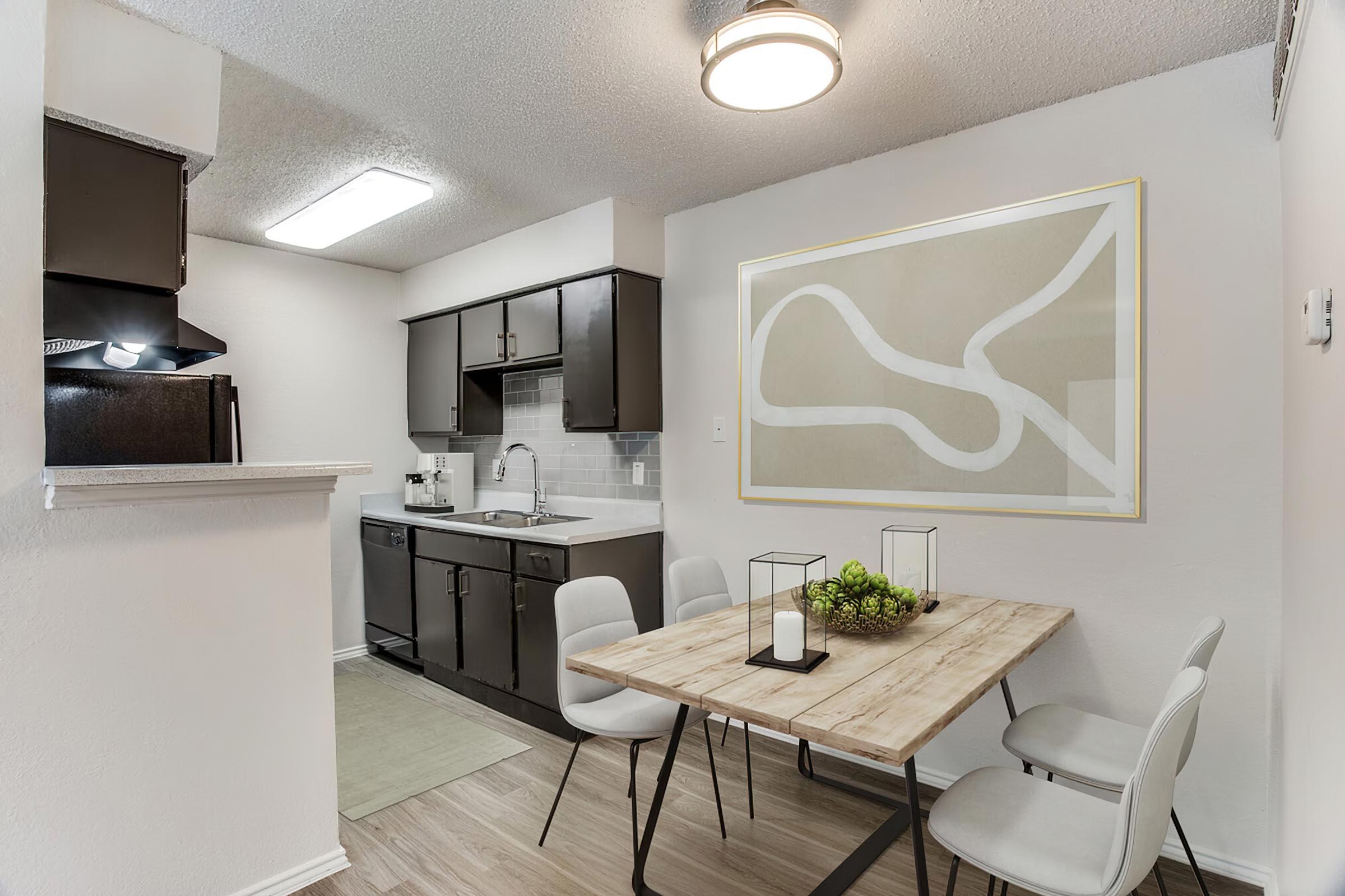 a kitchen with a table in a room