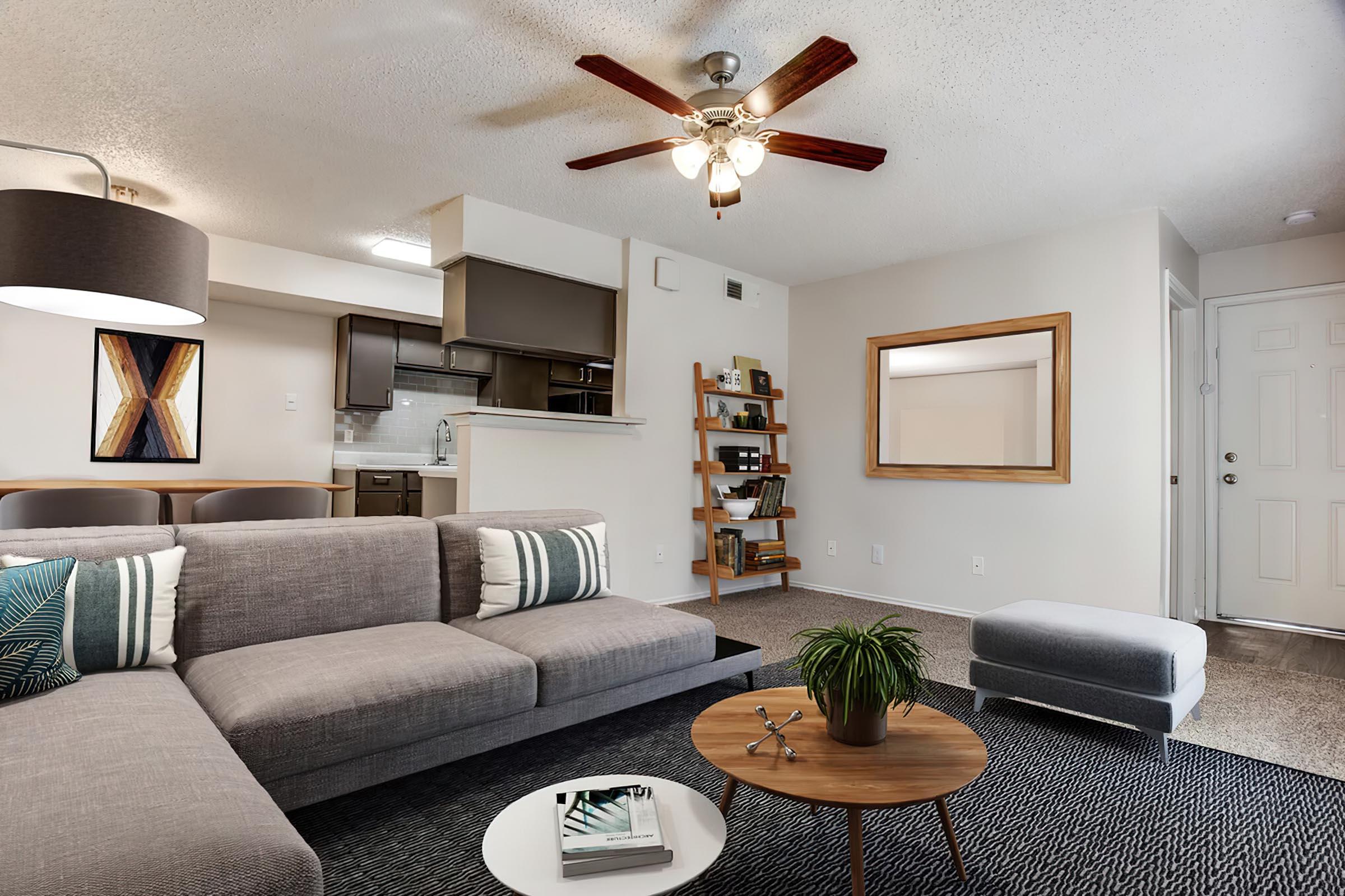 a living room filled with furniture and a flat screen tv