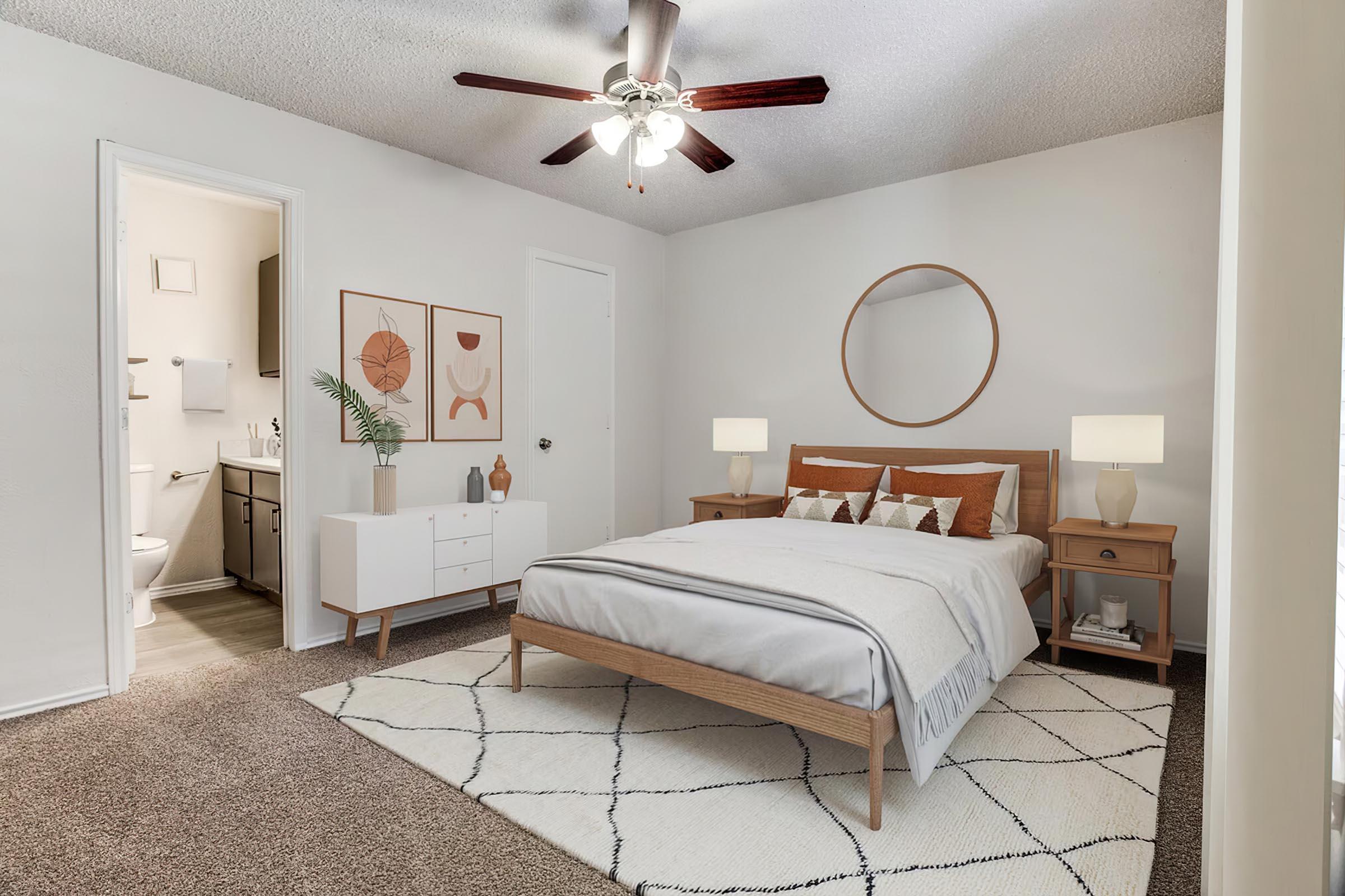 a bedroom with a bed and desk in a room