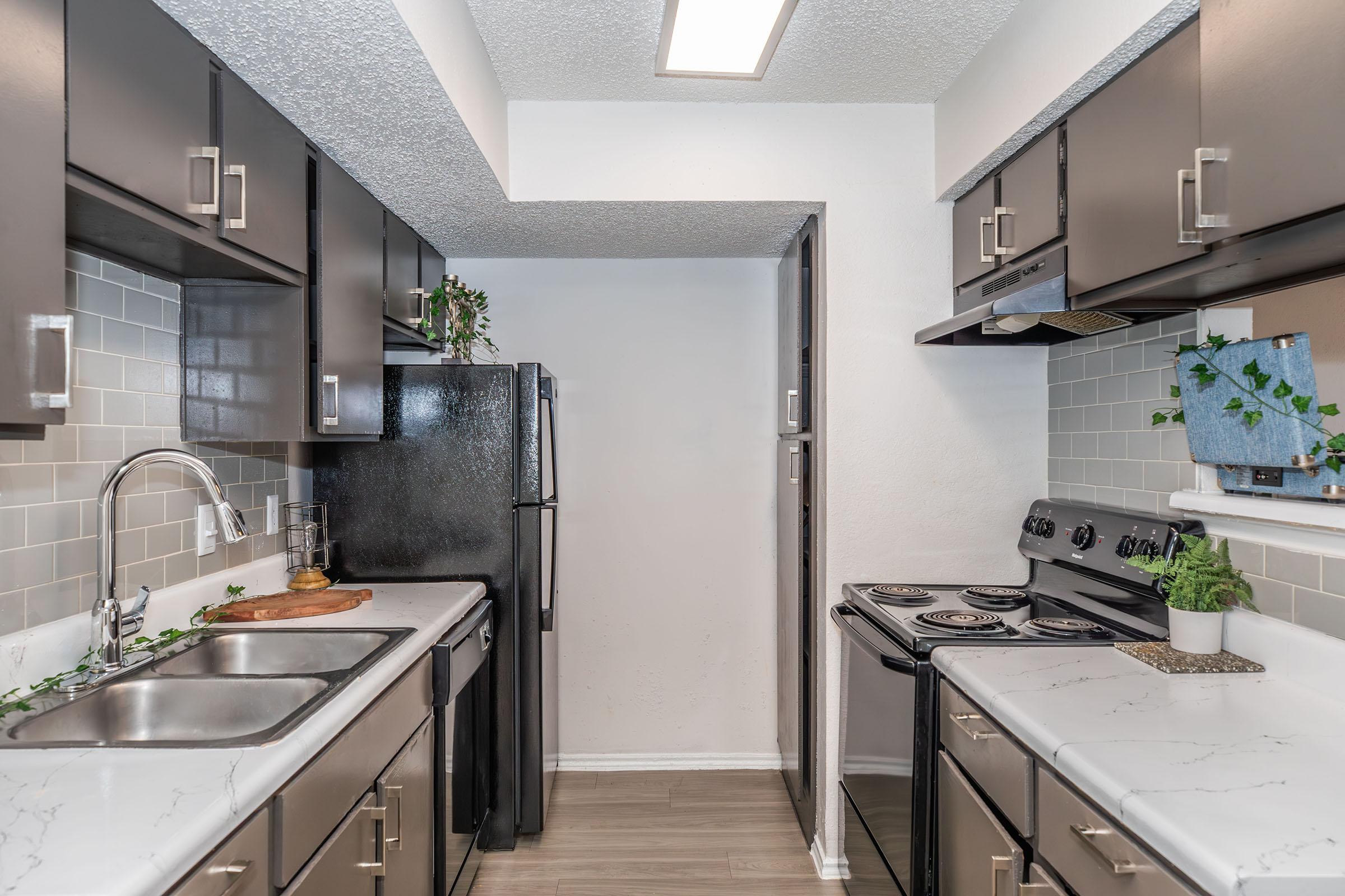 a kitchen with a stove and a sink