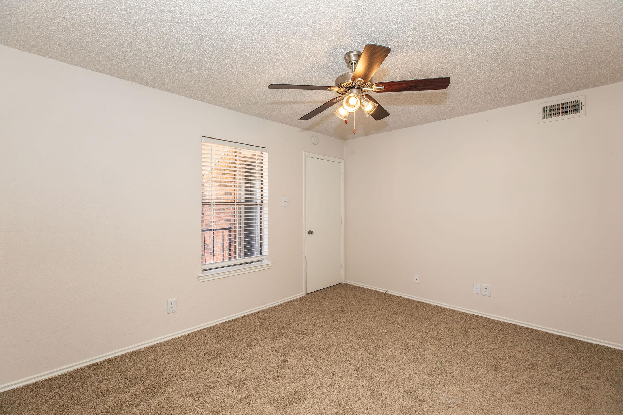 a bedroom with a large mirror