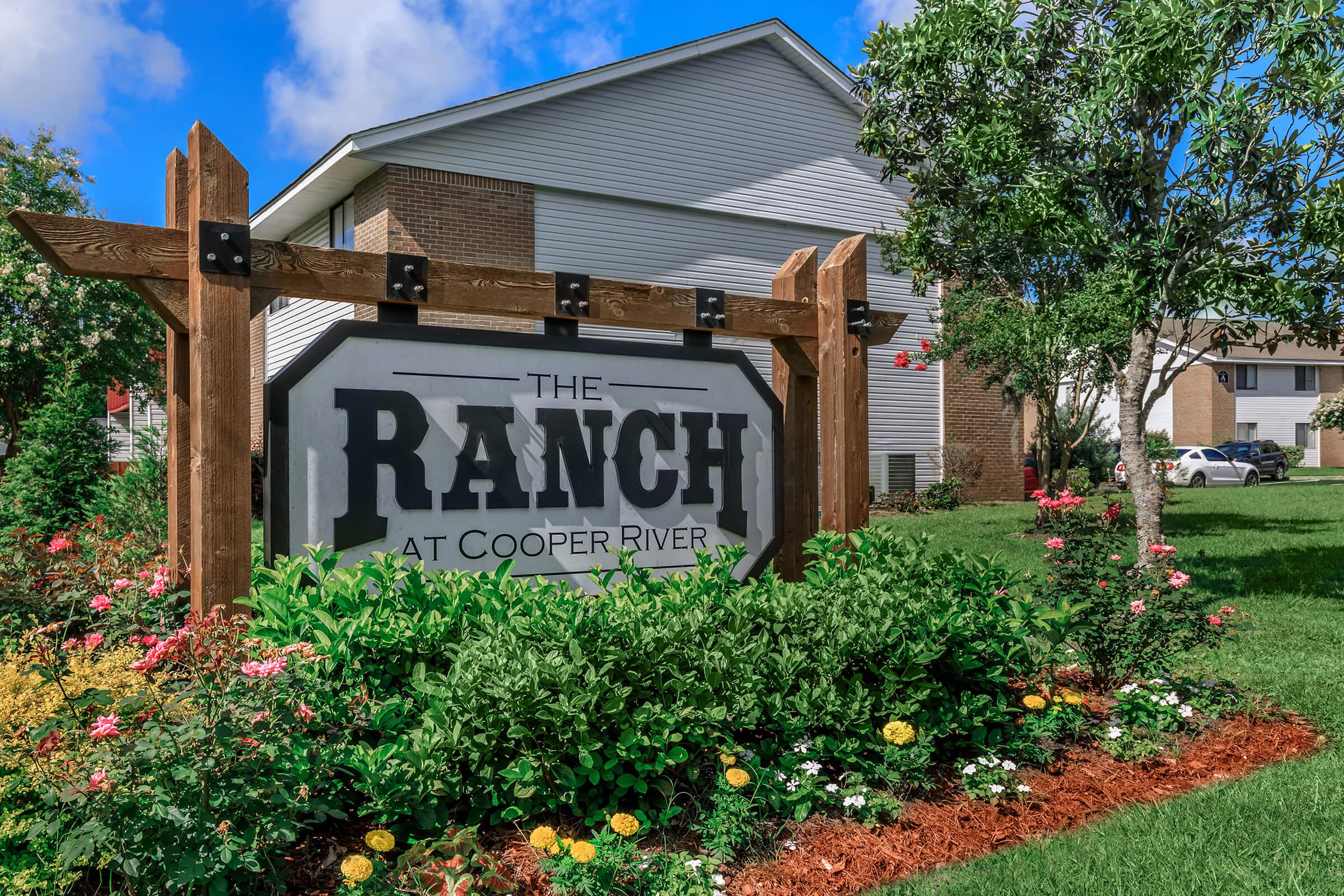 a sign in front of a house