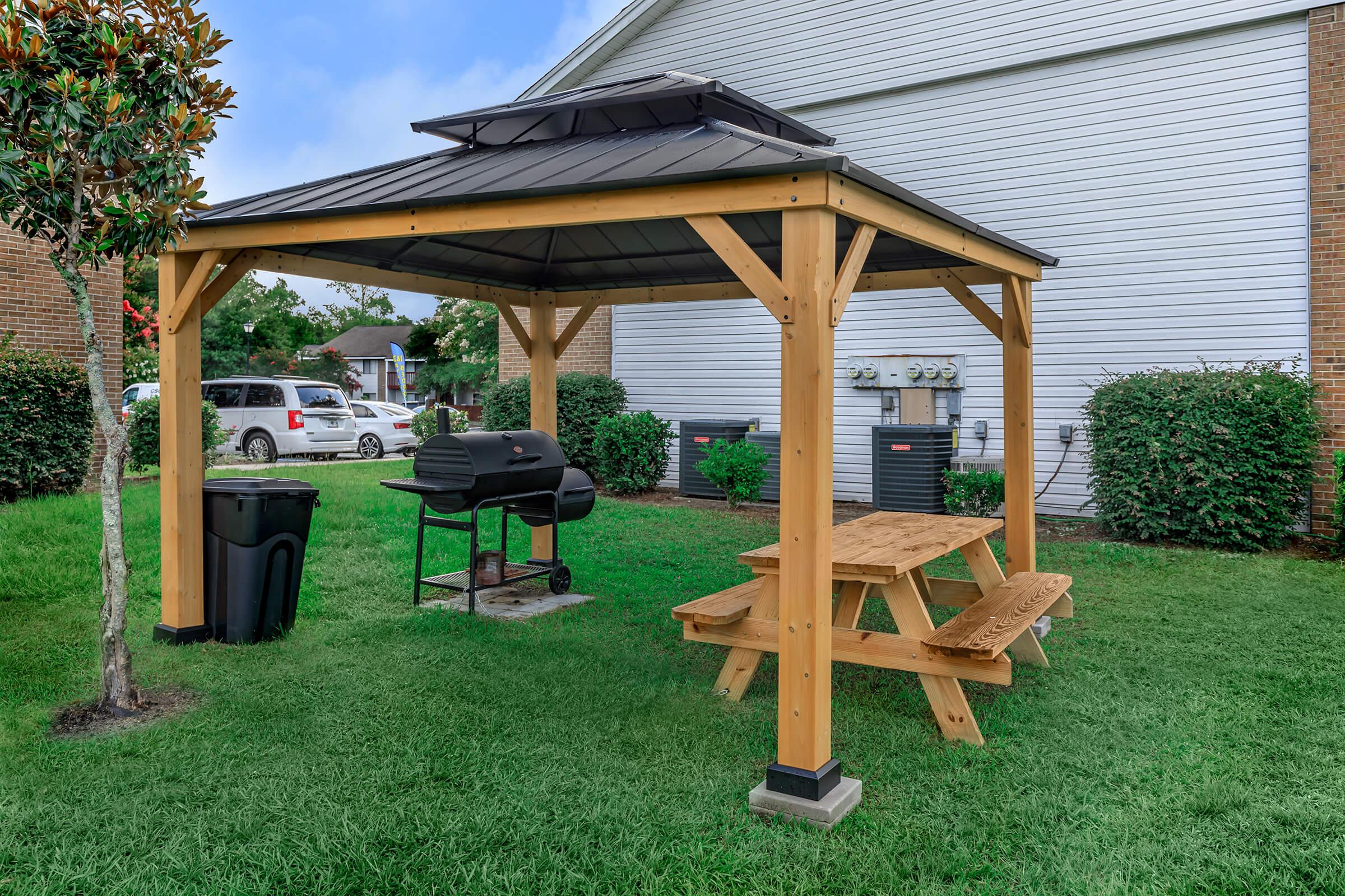 a group of lawn chairs sitting on top of a picnic table