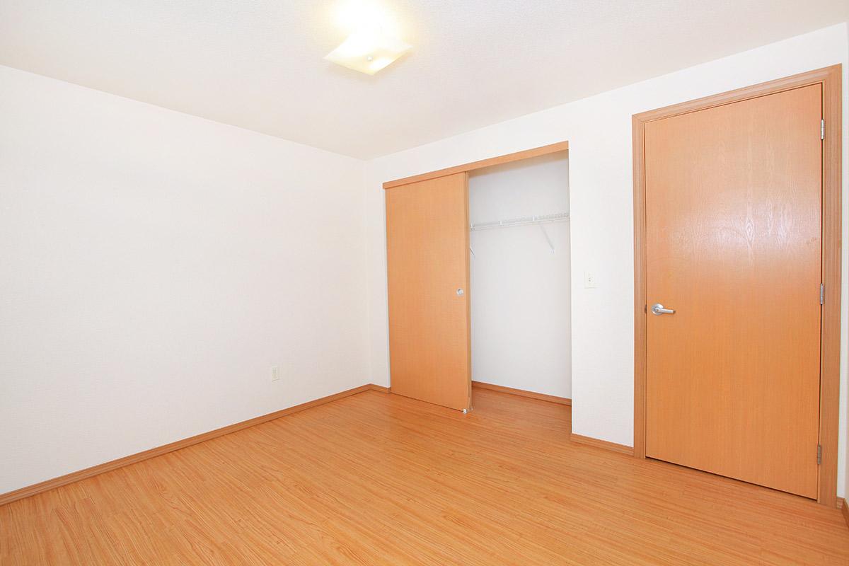 a kitchen with a wood floor