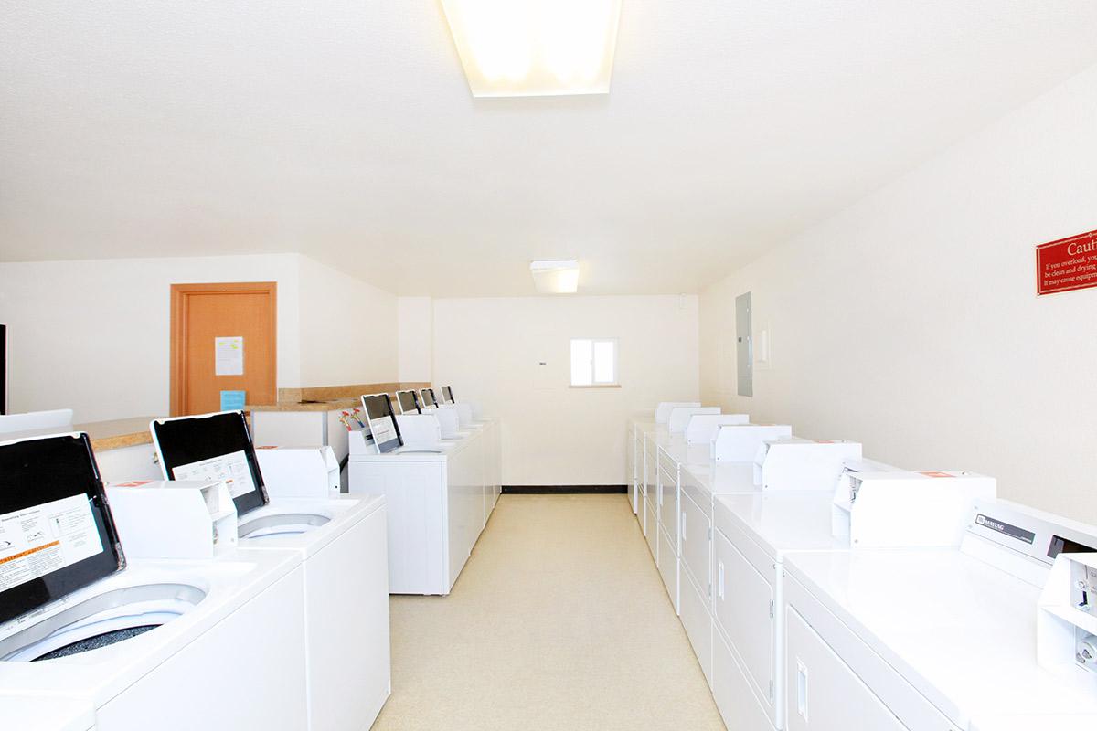 a large white refrigerator in a kitchen