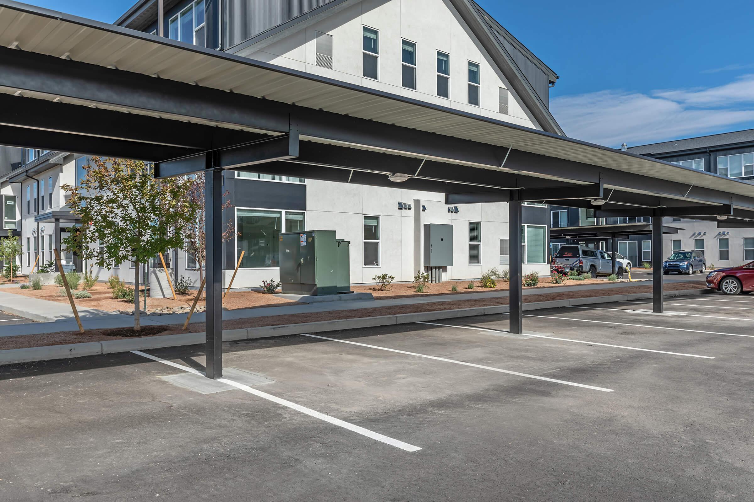 a train is parked on the side of a building