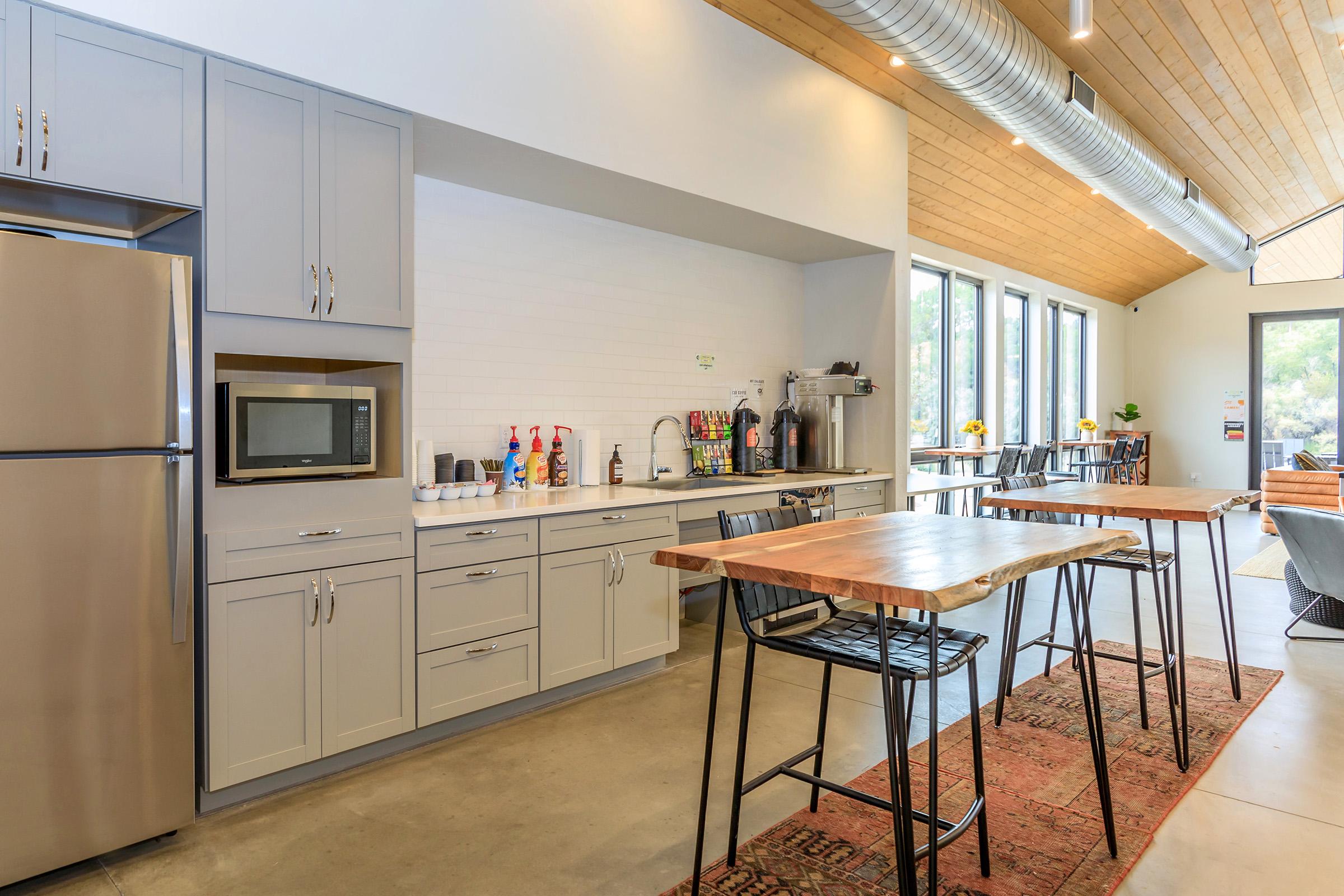 a kitchen with a dining table