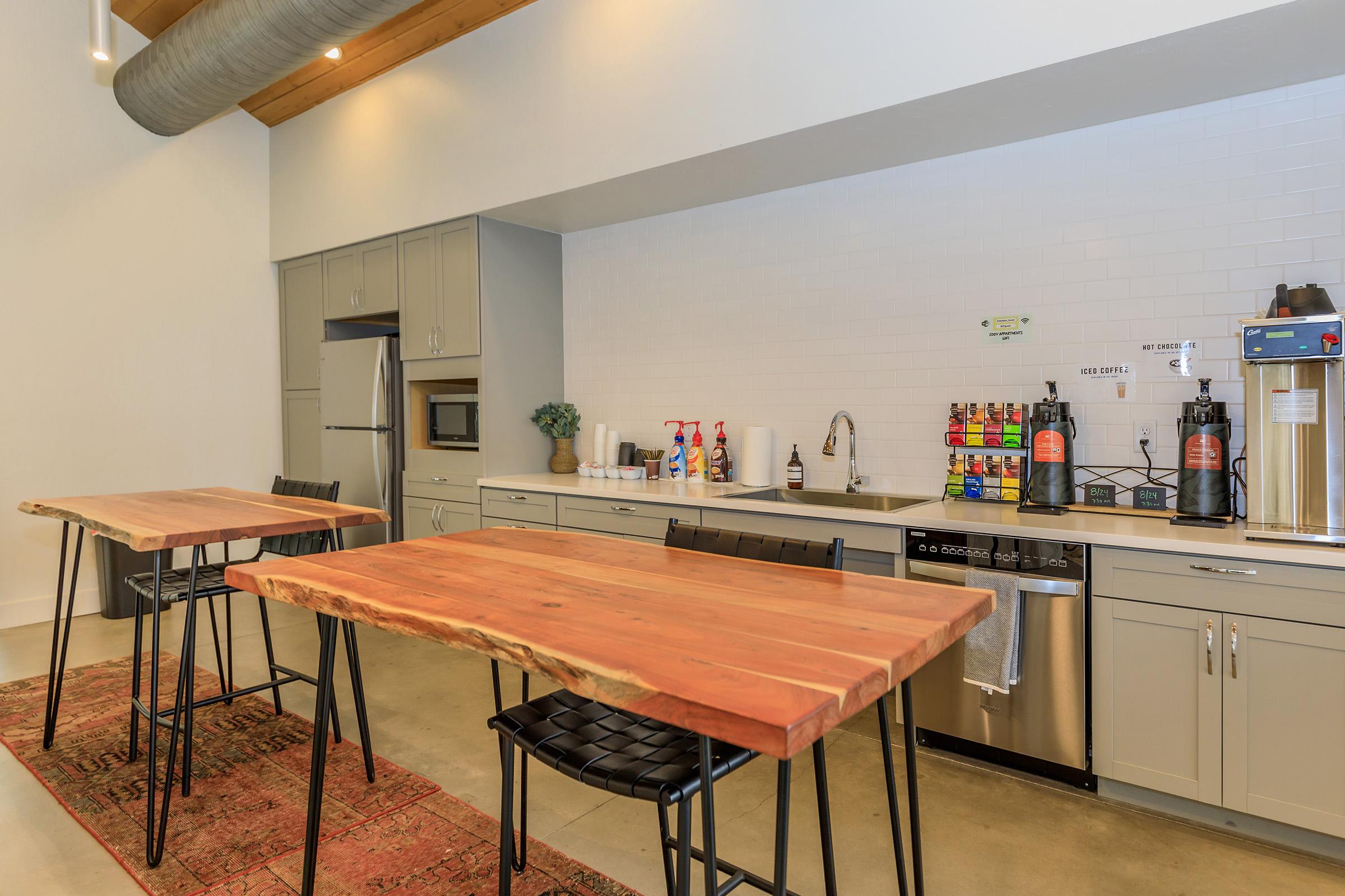 a kitchen with a dining room table