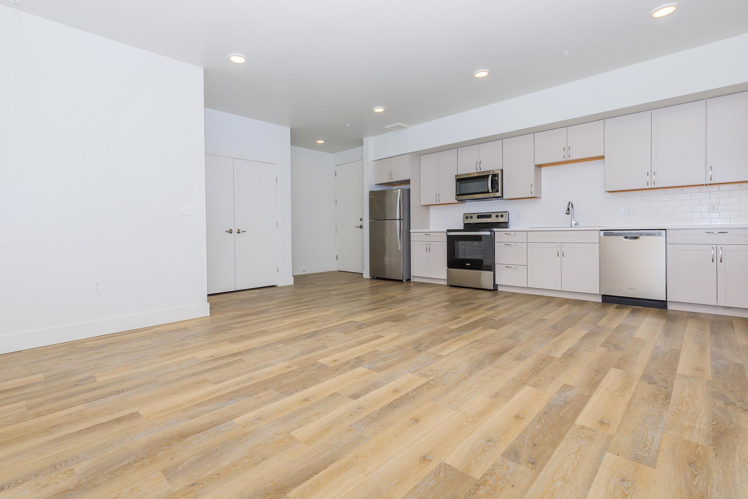 a kitchen with a wooden floor