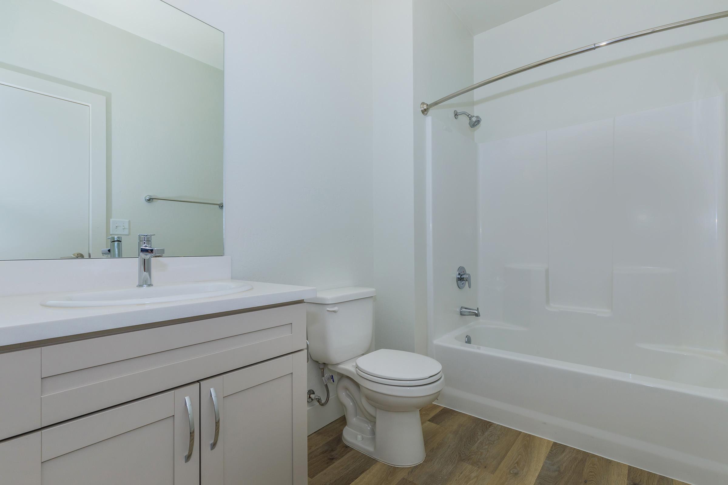 a room with a sink and a shower