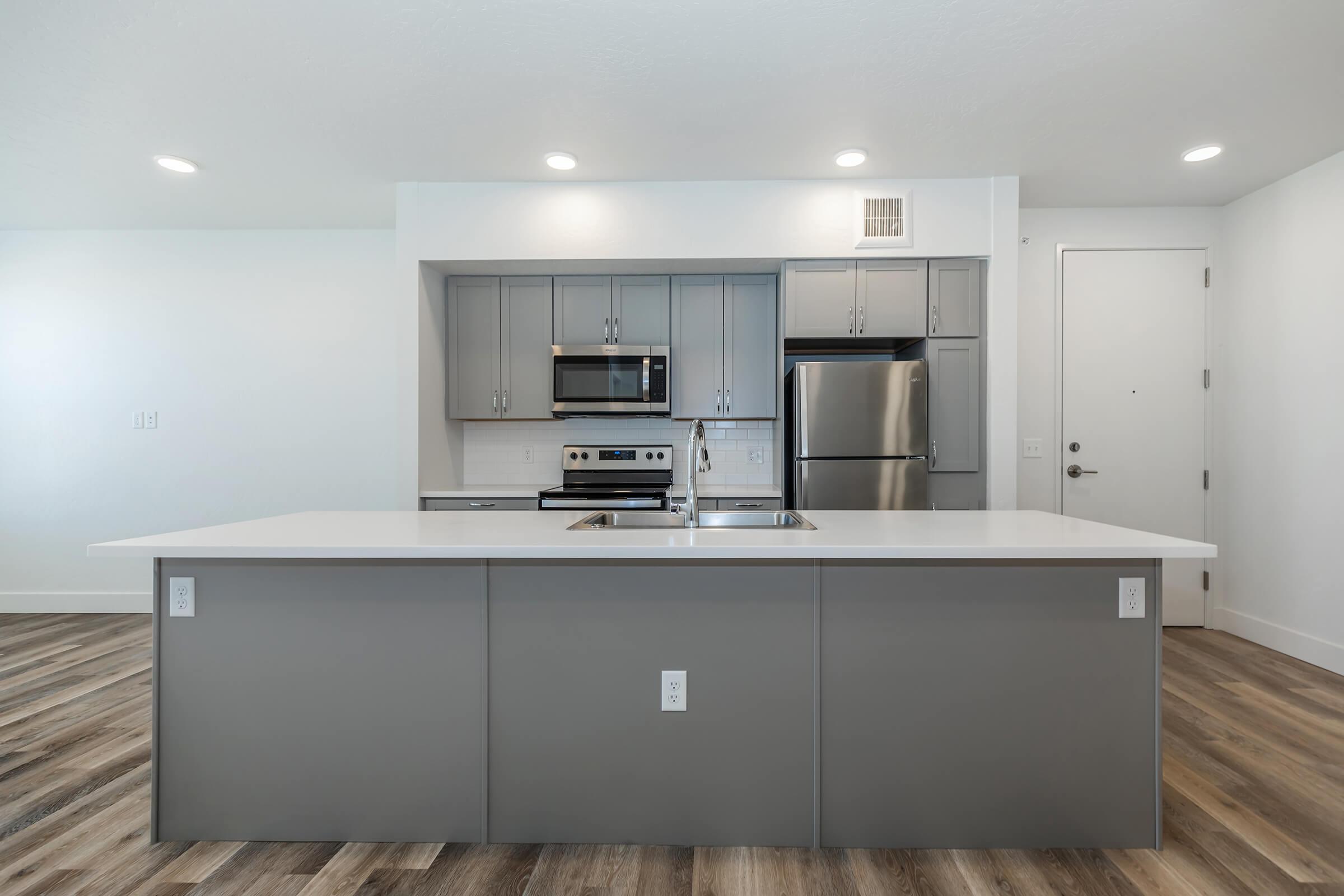 a stainless steel refrigerator in a kitchen