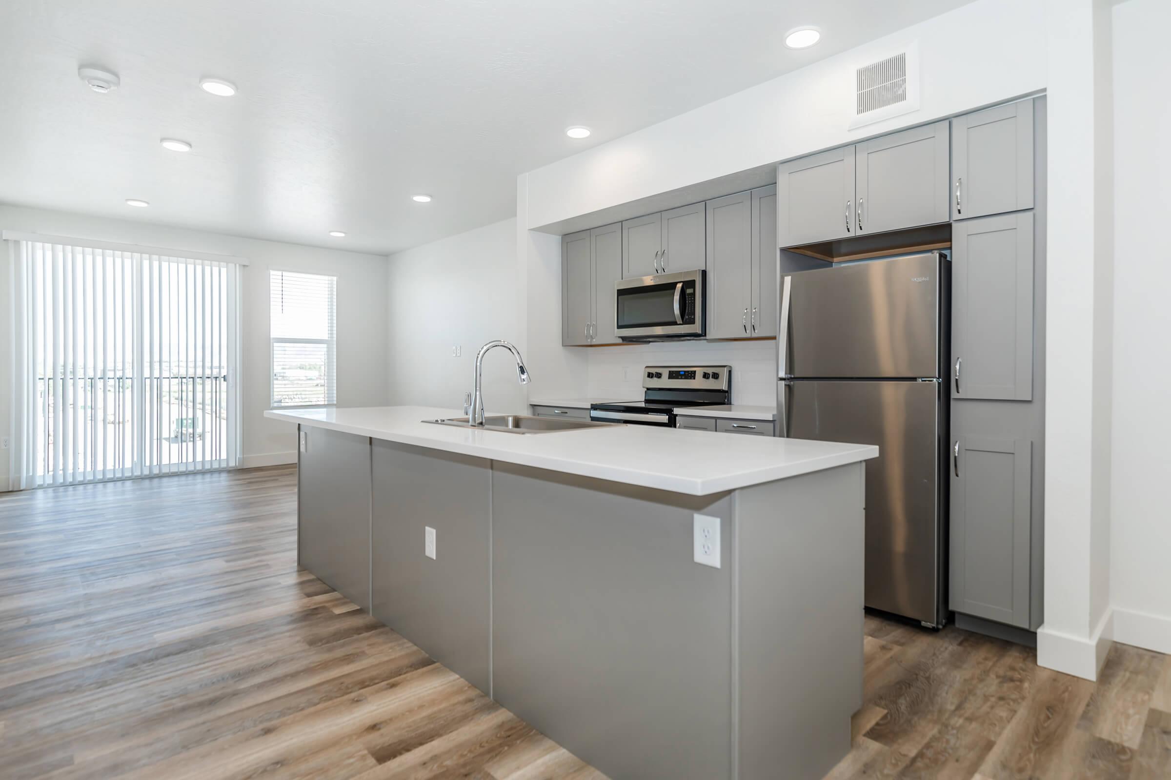 a kitchen with a wooden floor