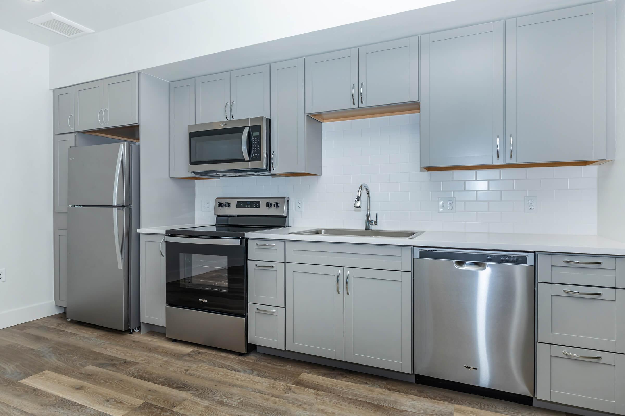 a kitchen with a stove and a refrigerator