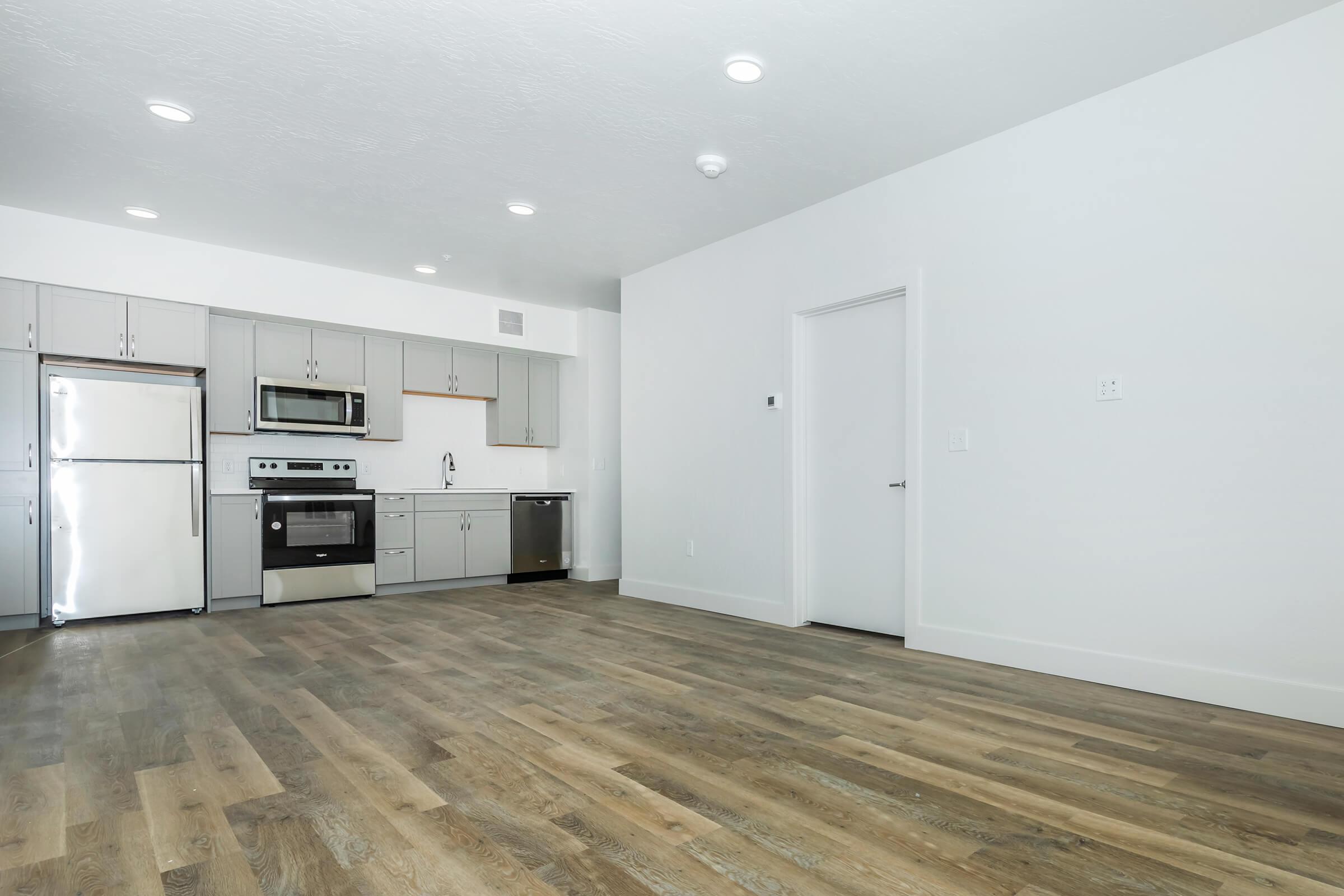 a large kitchen with stainless steel appliances