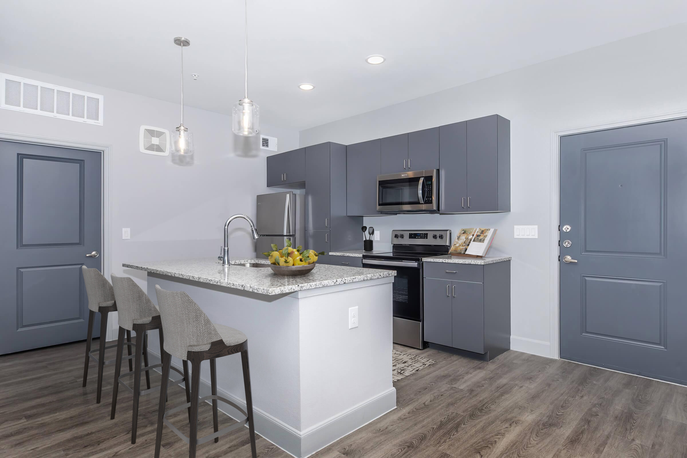 a kitchen with a sink and a refrigerator