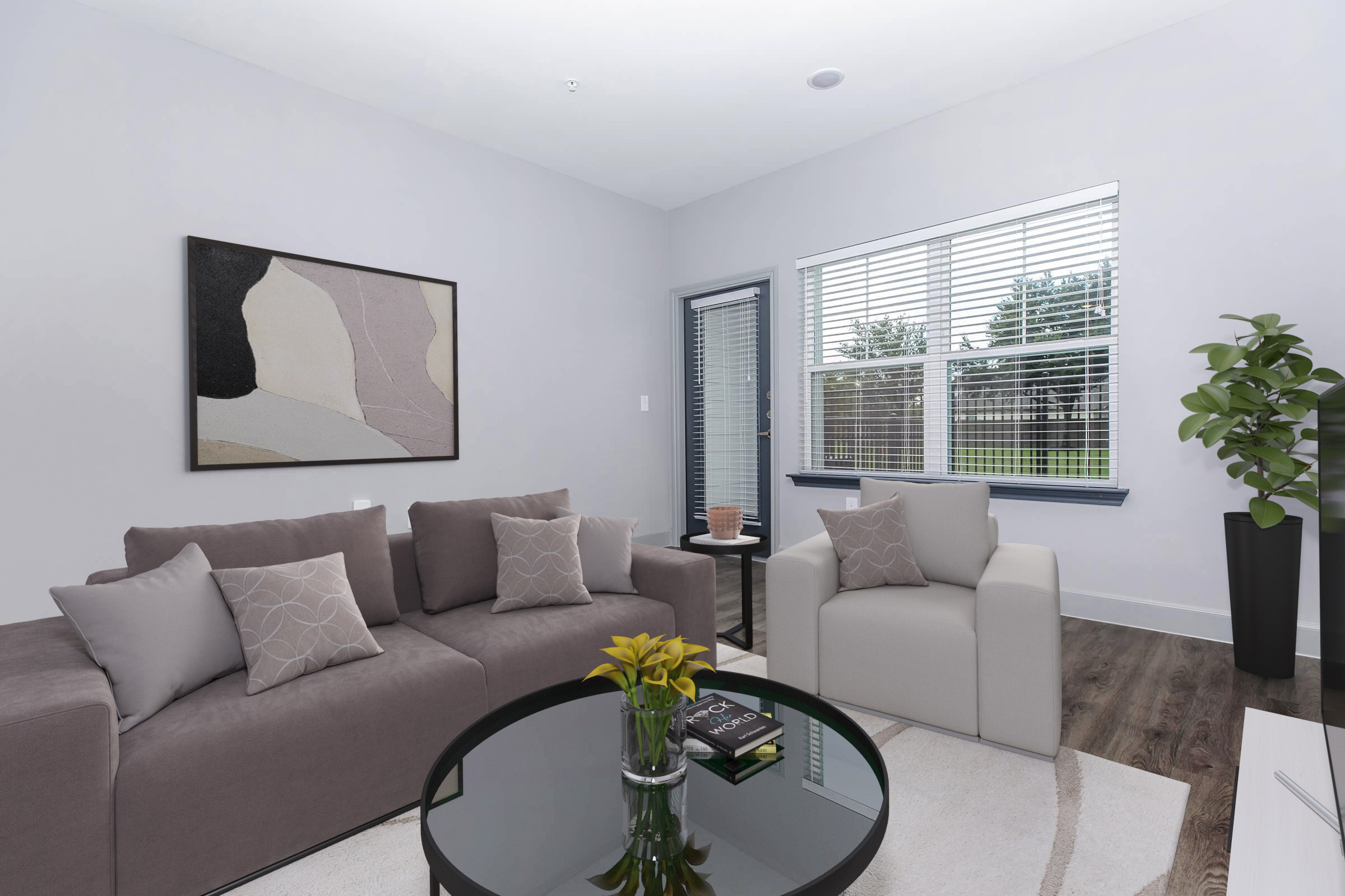 a living room filled with furniture and a flat screen tv