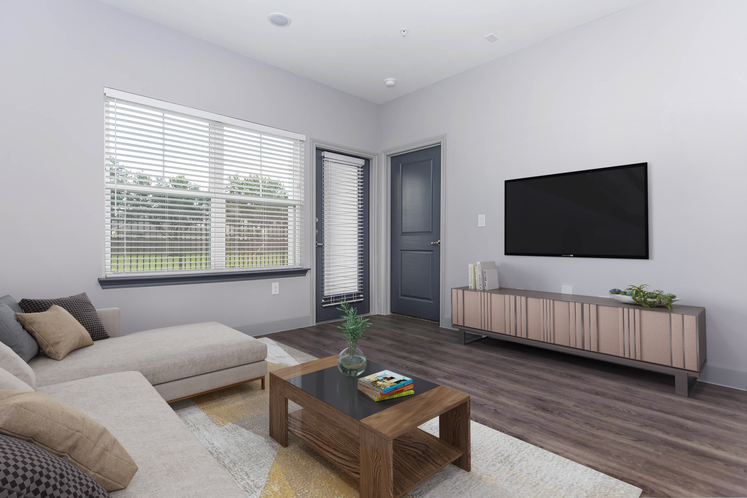 a living room filled with furniture and a flat screen tv