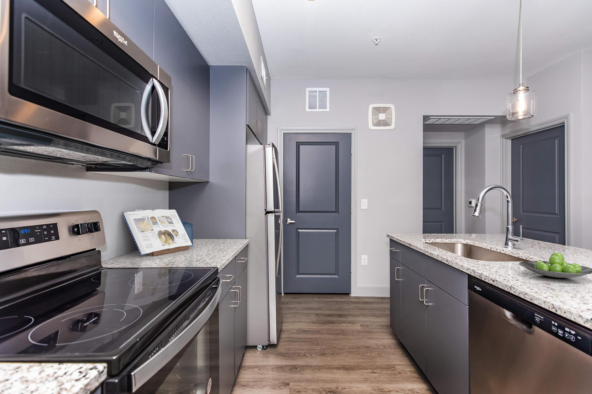 a stove top oven sitting inside of a kitchen