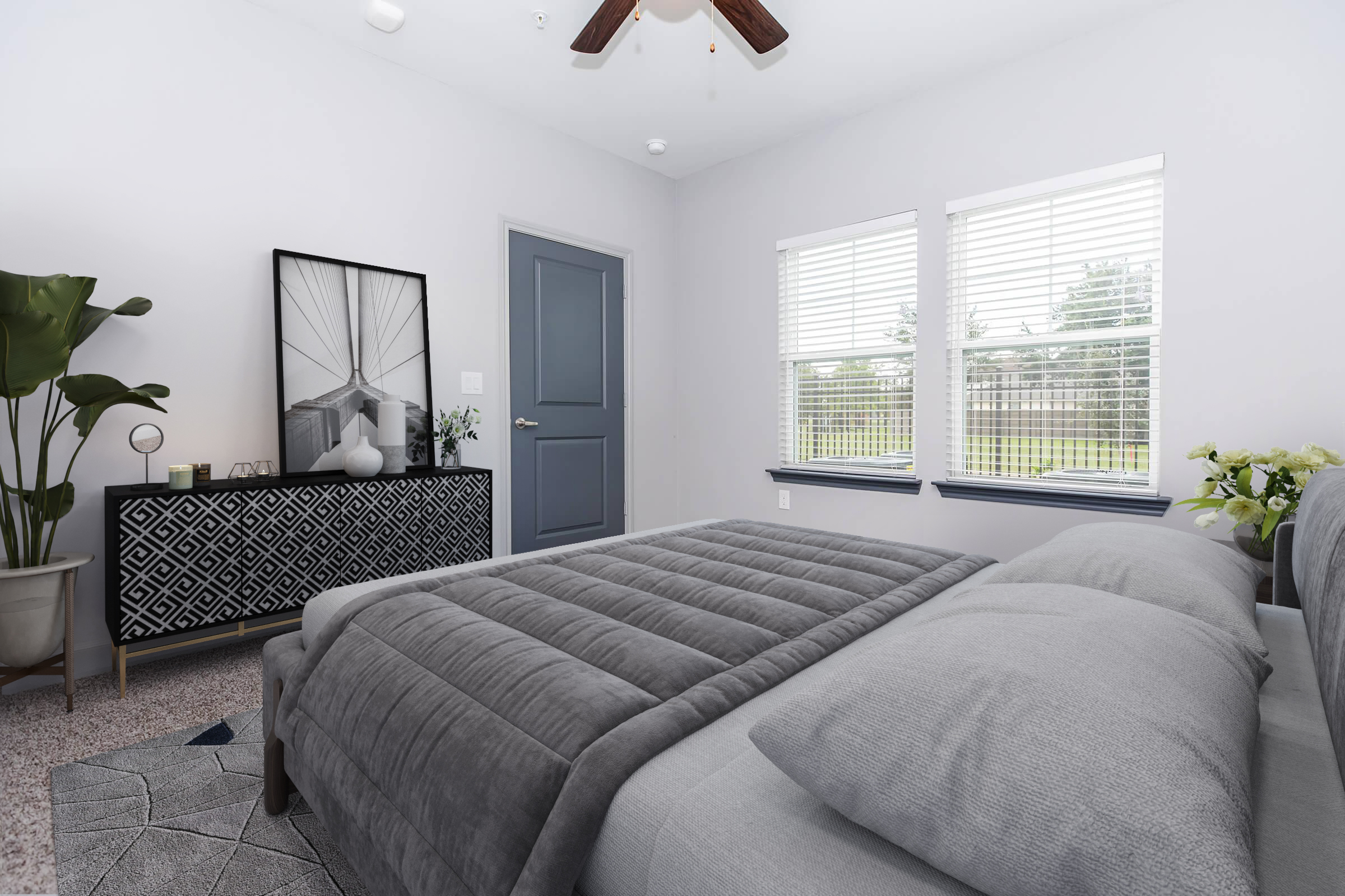 a bedroom with a bed and a chair in a room