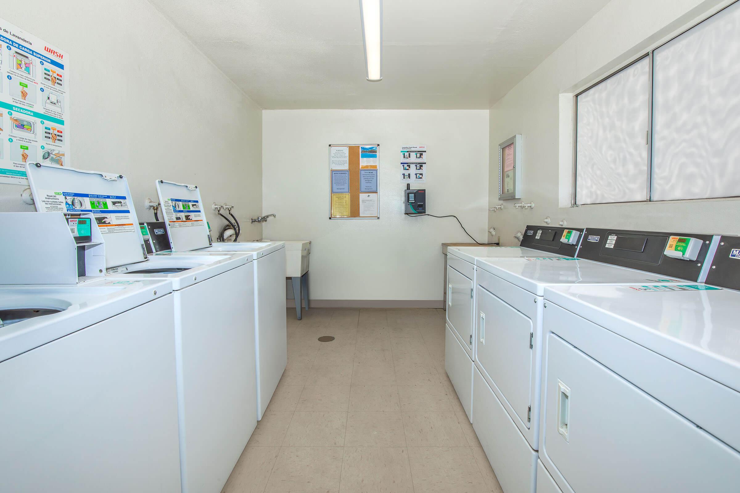 a kitchen with a sink and a refrigerator