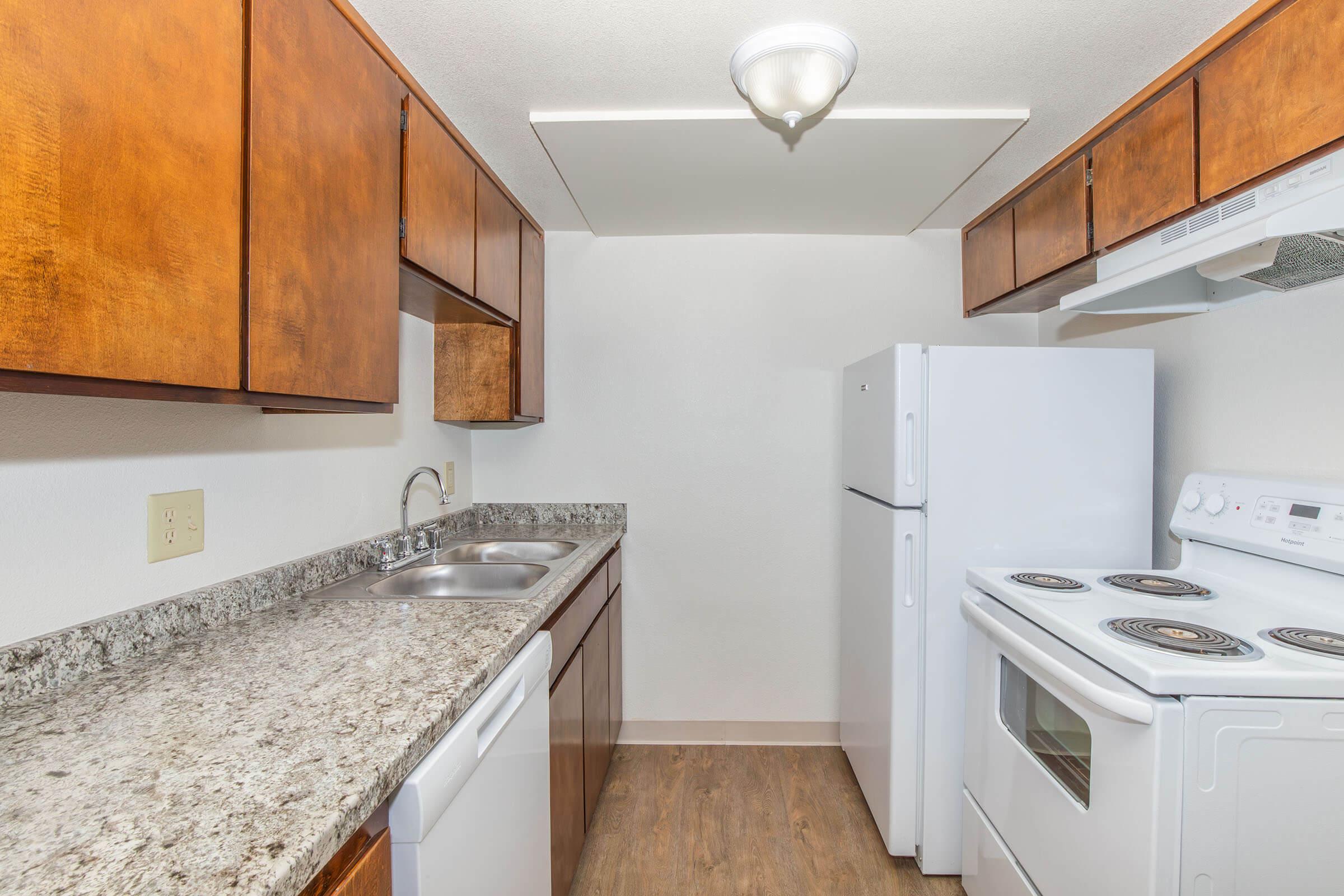 a kitchen with a stove top oven sitting inside of a refrigerator