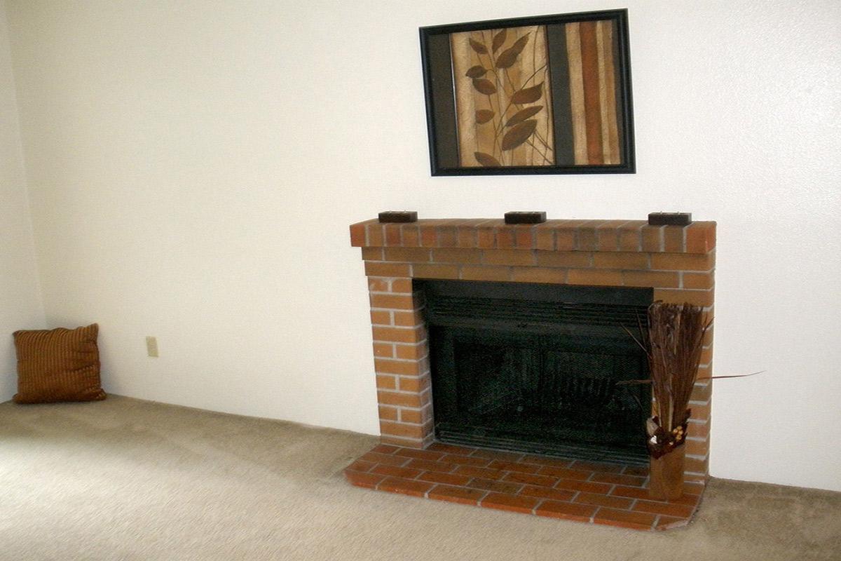 a fire place sitting in a living room with a fireplace