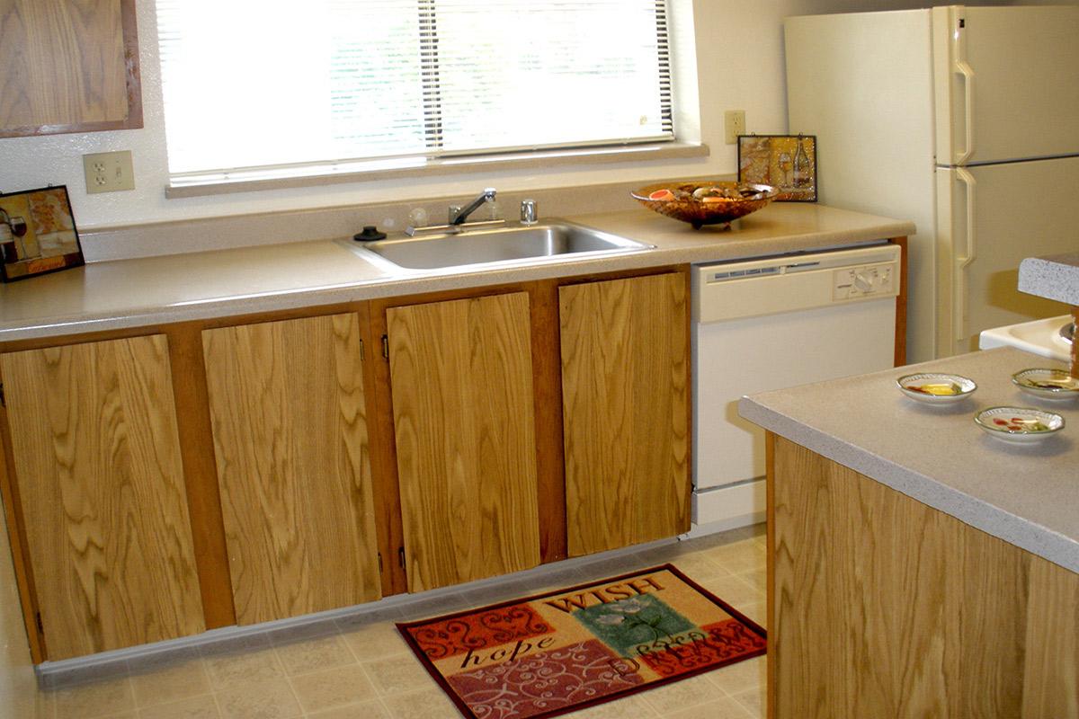a kitchen with a sink and a window