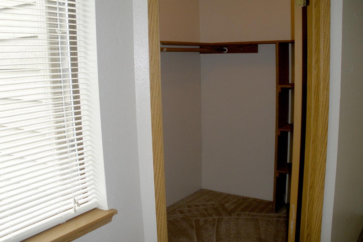 a white sink sitting under a window