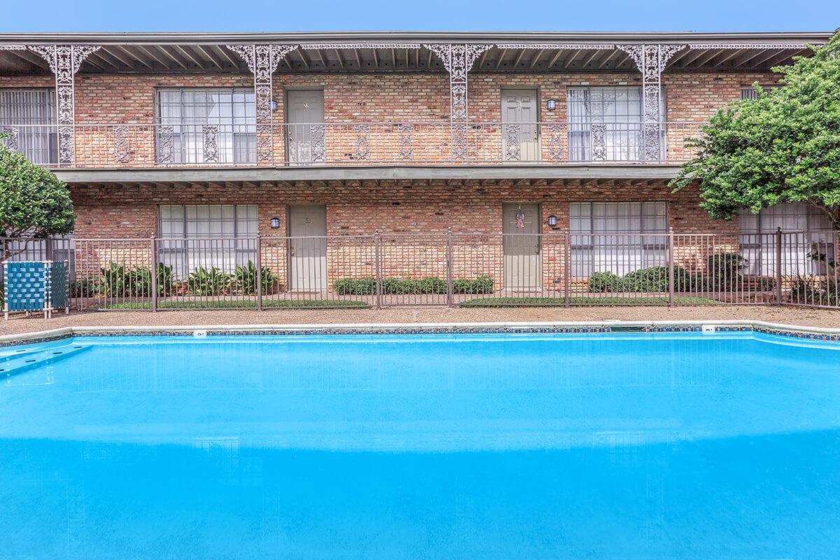 a large pool of water in front of a building