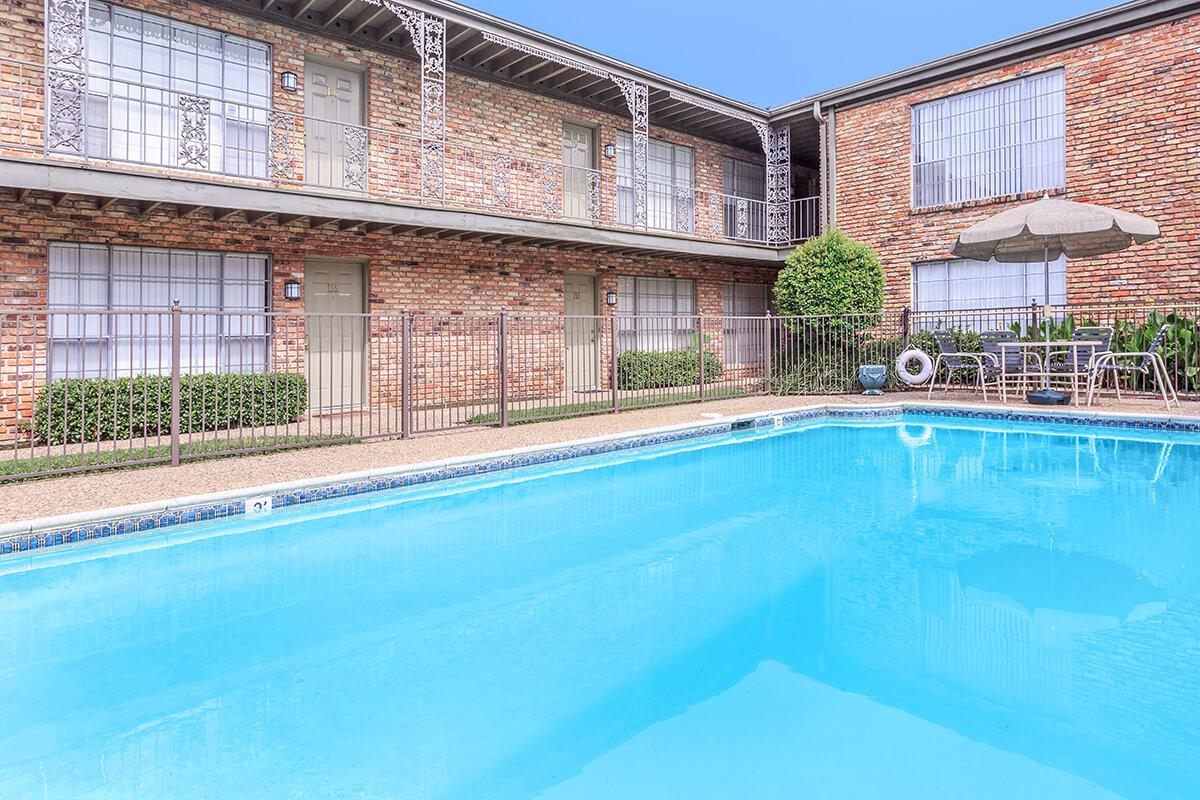 a large pool of water in front of a building