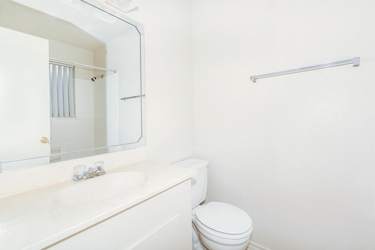 a large white tub next to a shower