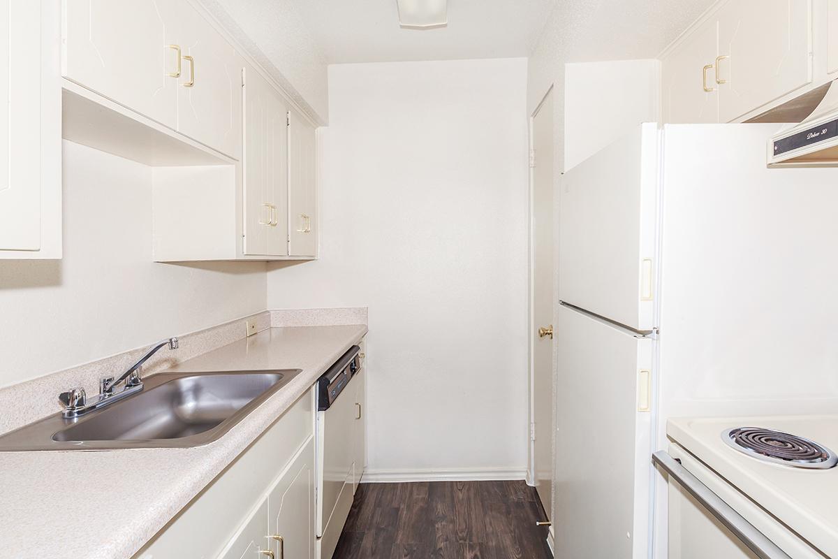 a kitchen with a stove and a sink