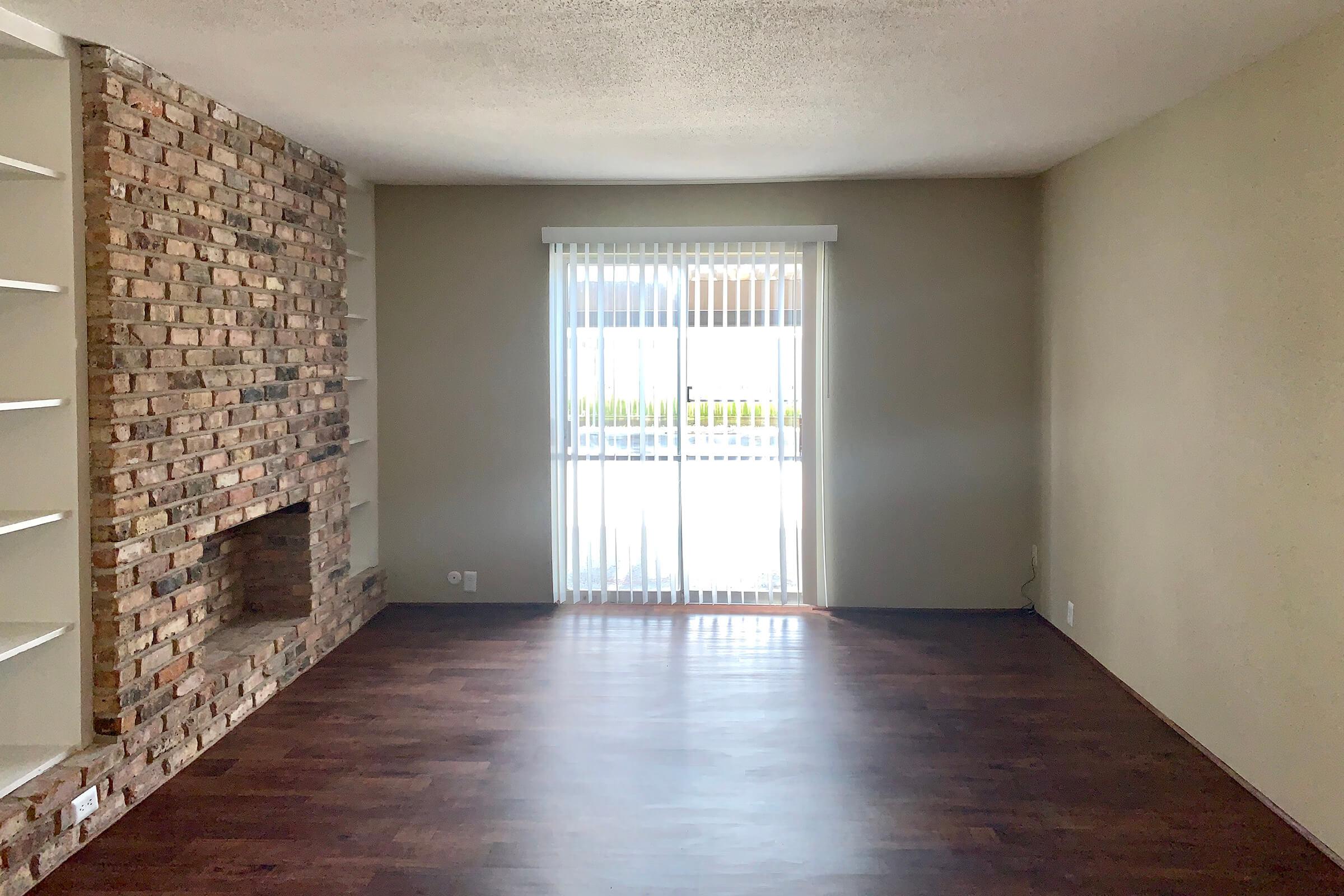 a large empty room with a tiled floor