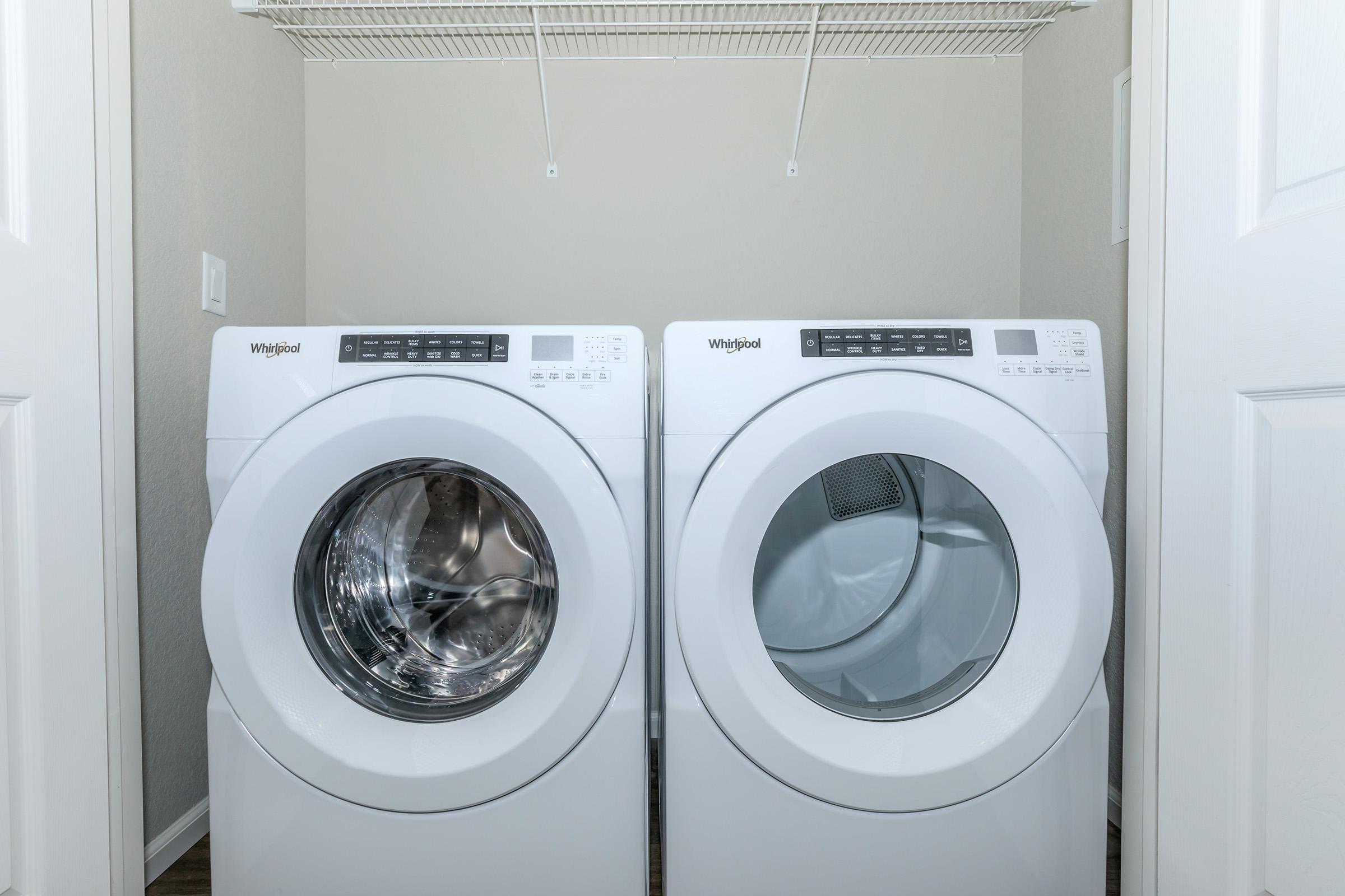 a white refrigerator freezer sitting in a room