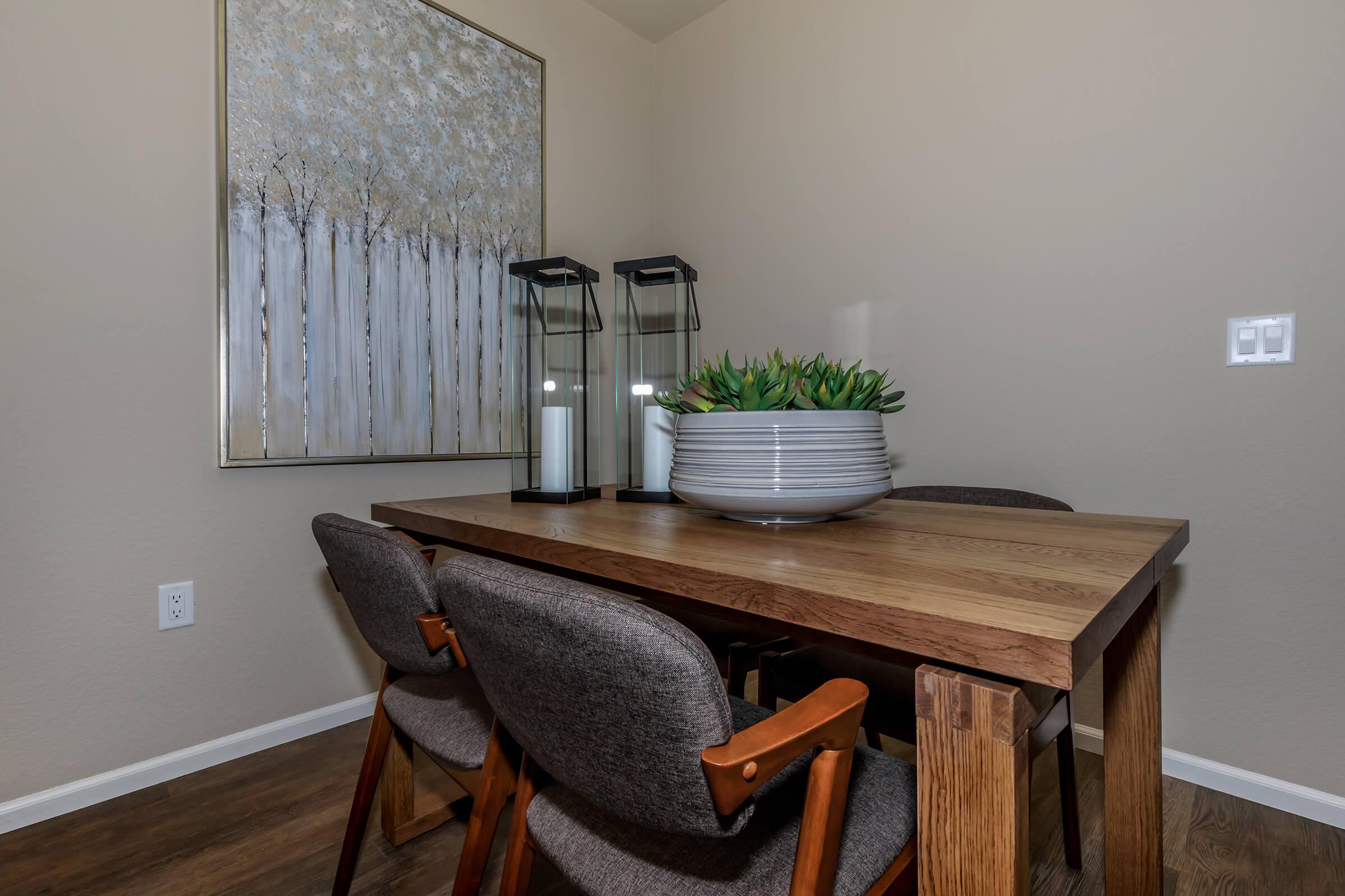 a chair sitting in front of a wooden table