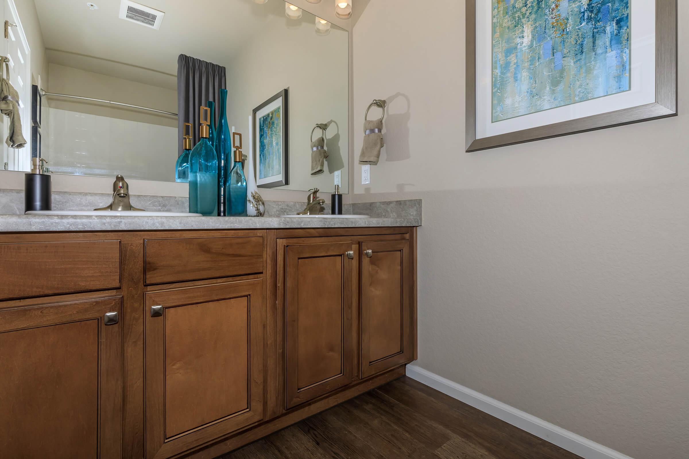 a kitchen with a sink and a mirror