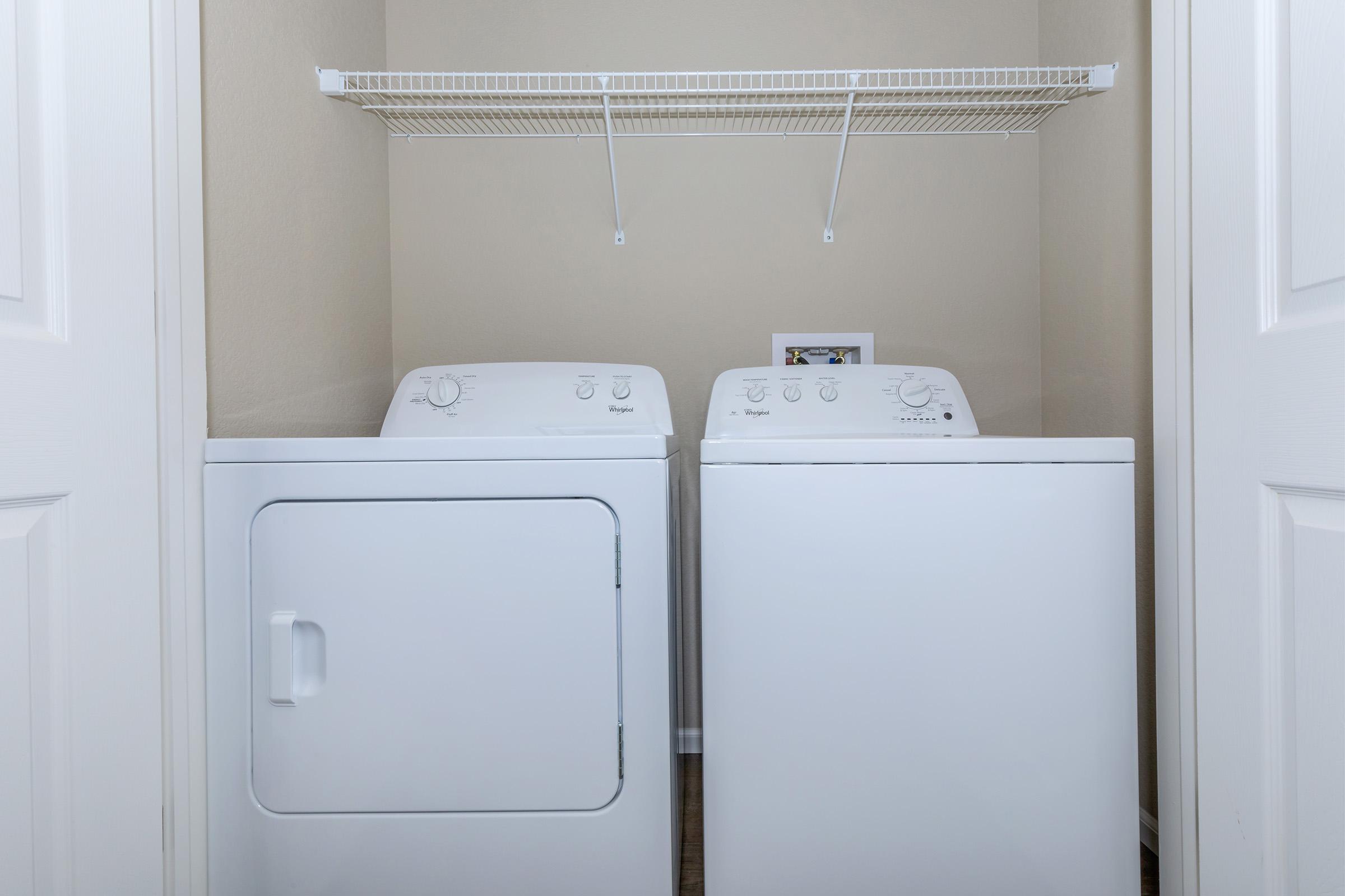 a white refrigerator freezer sitting inside of a kitchen