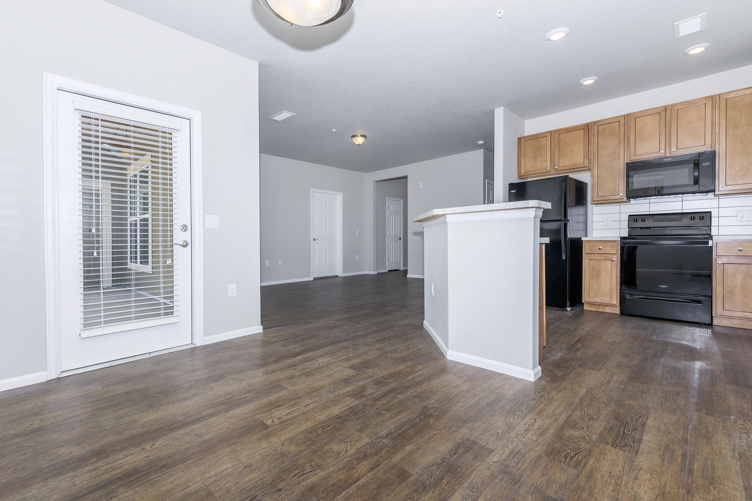 a large kitchen with stainless steel appliances